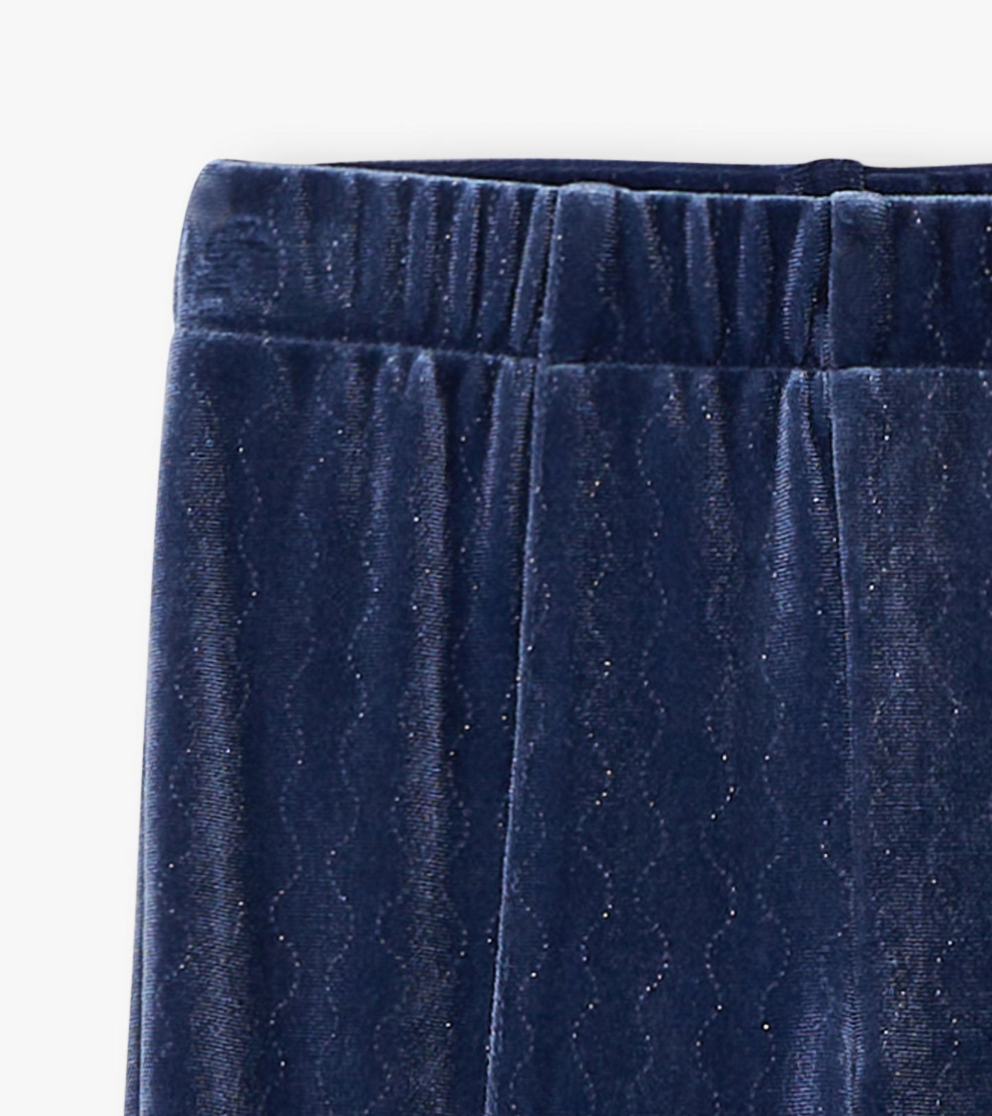 Navy stretchy flared pants with a wavy pattern and subtle sparkle, featuring an elastic waistband.