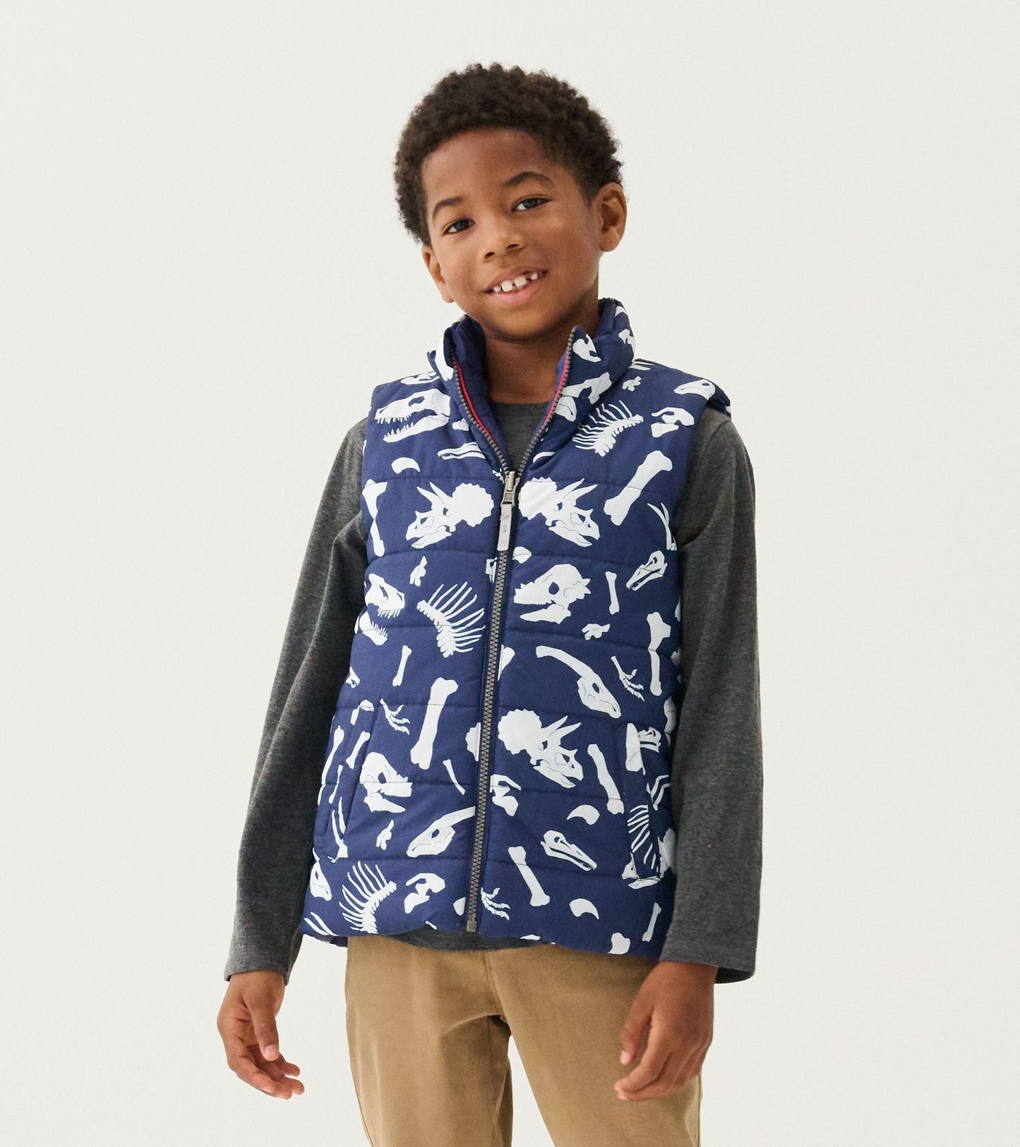 Veste sans manches matelassée réversible – Fossiles de dinosaure
