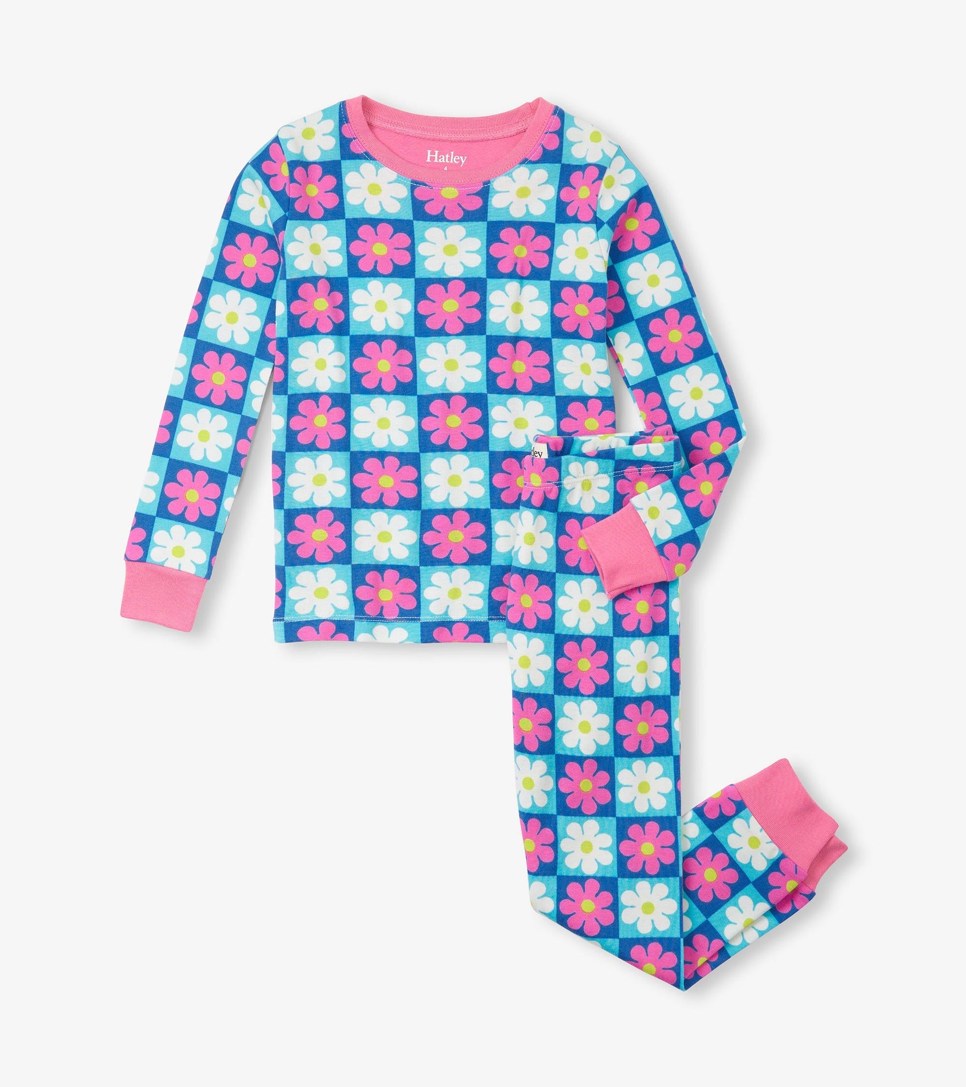 Blue checkered pajama set featuring colorful daisies, with pink cuffs and neckline, made from organic cotton.