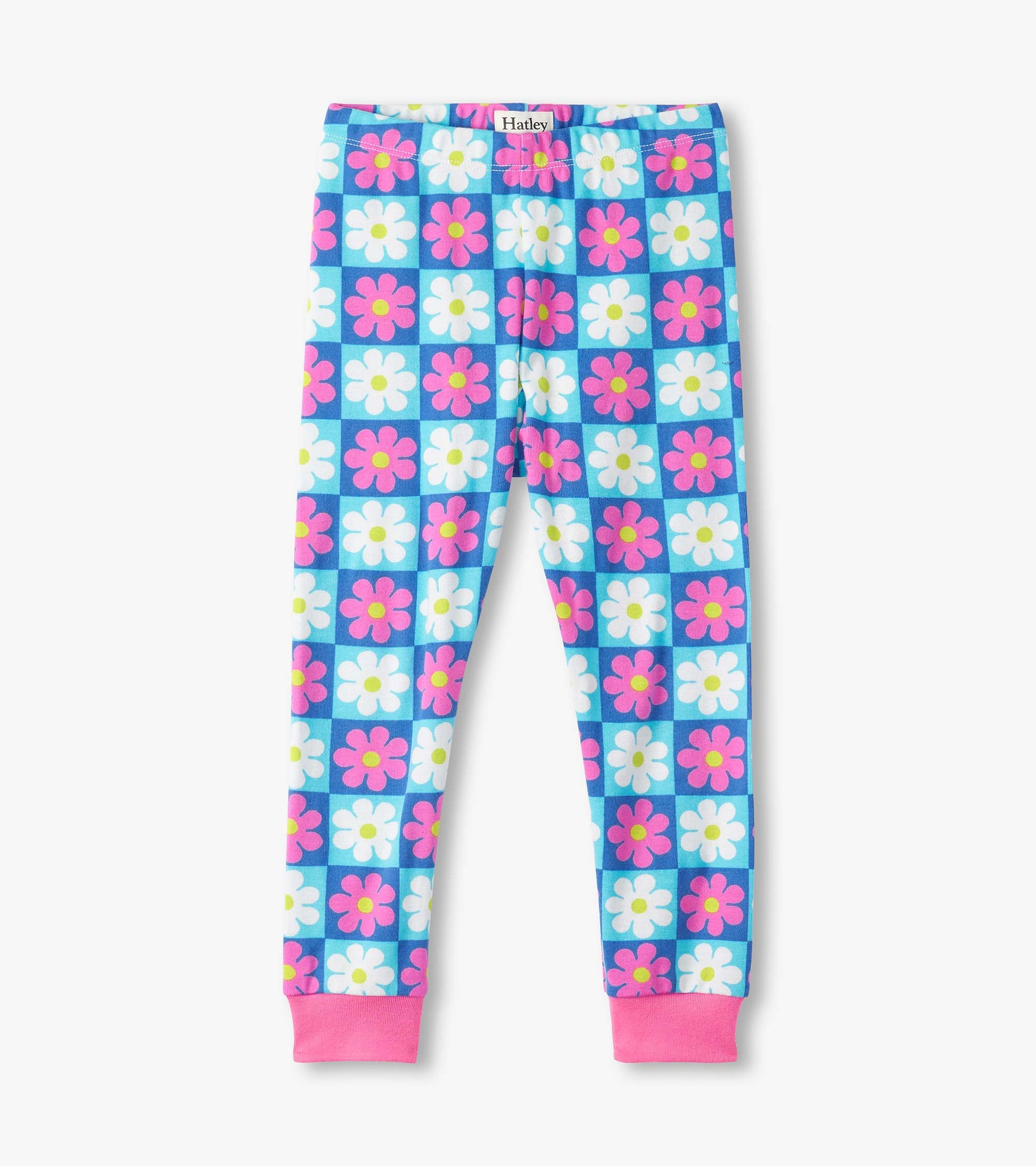 Colorful checkered pajama pants featuring pink and white daisies on a blue background, with pink cuffs at the ankles.