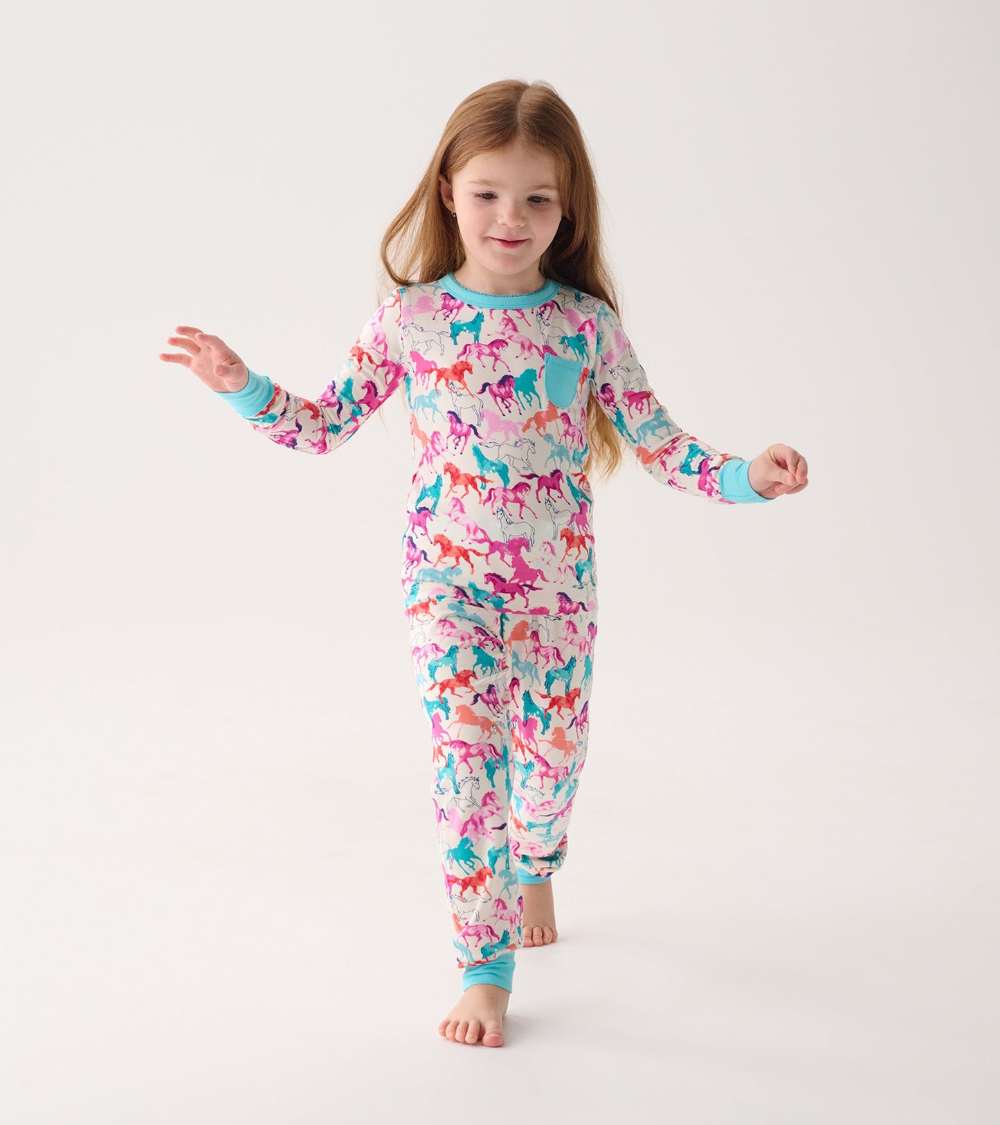 Colorful bamboo pajama set featuring playful horse patterns, with long sleeves and matching pants.
