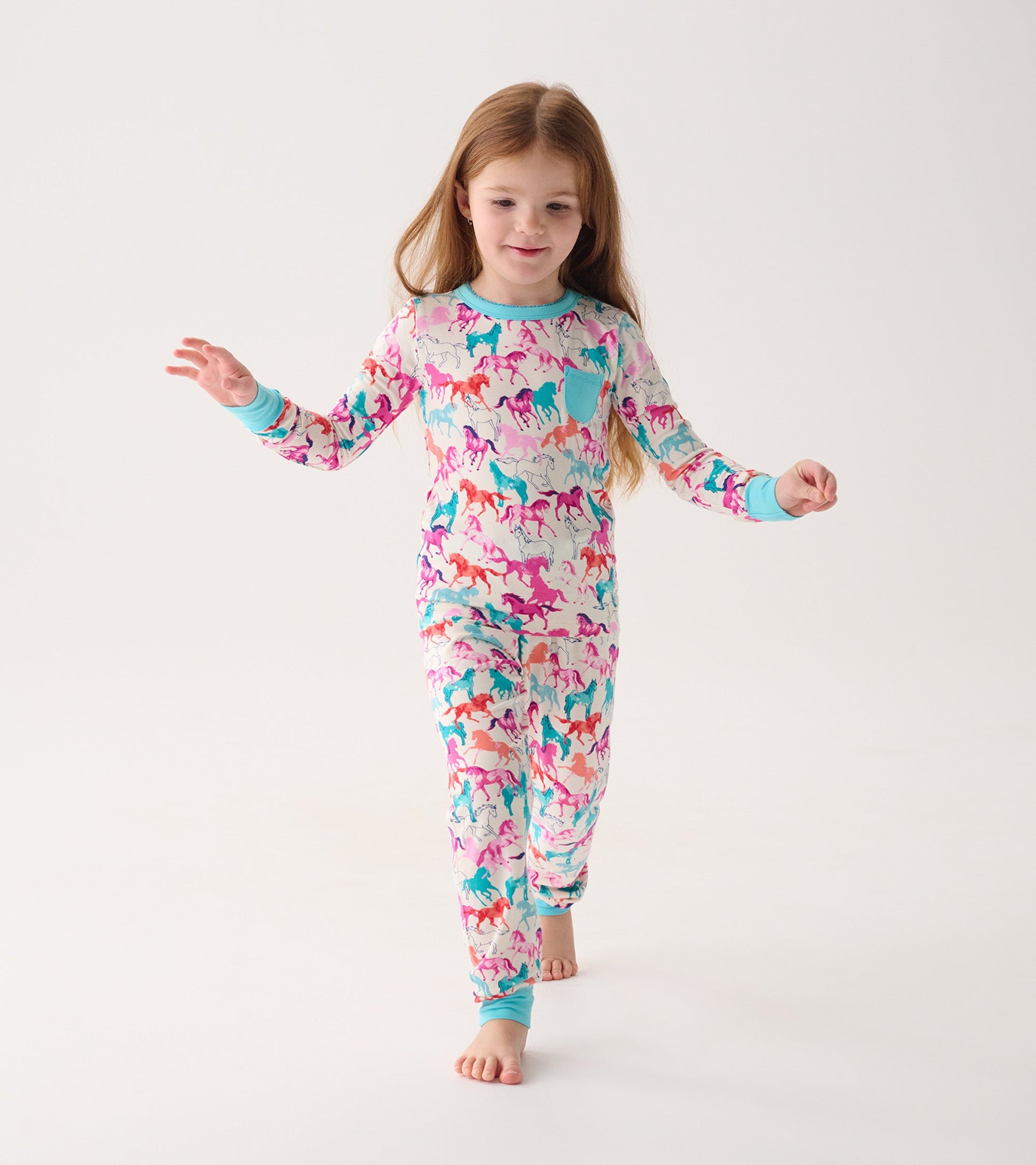 Colorful bamboo pajama set featuring playful horse patterns, with long sleeves and matching pants.