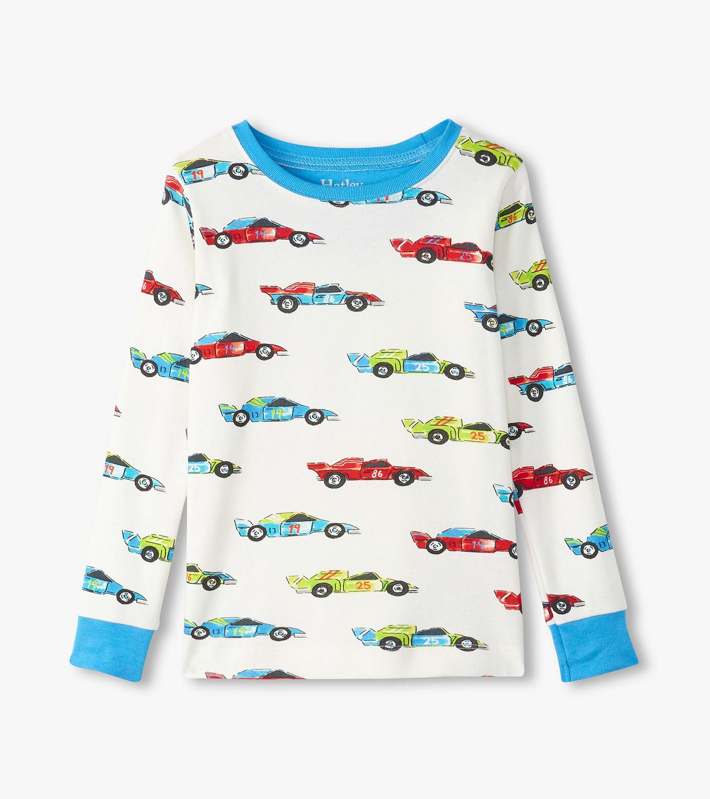 Long-sleeve pajama top in organic cotton featuring colorful racecar prints on a white background, with blue cuffs.