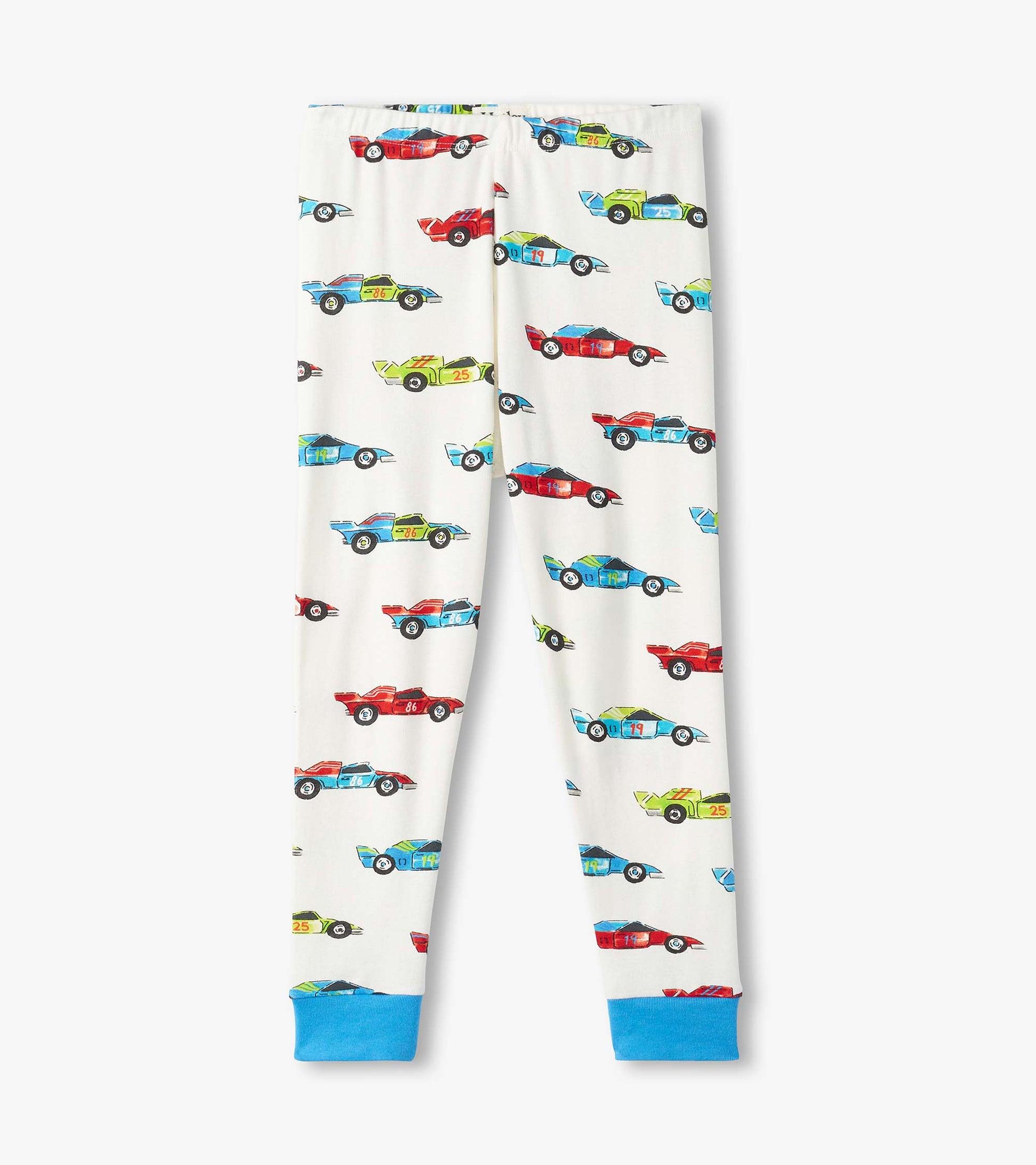 Organic cotton pajama set featuring colorful racecar prints on a white background, with blue cuffs at the ankles.
