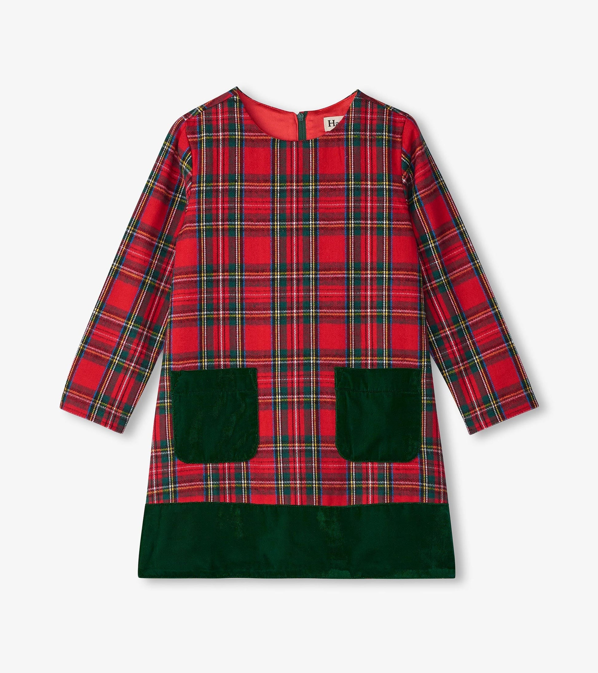 Red plaid A-line dress with long sleeves, green pockets, and a solid green hem.