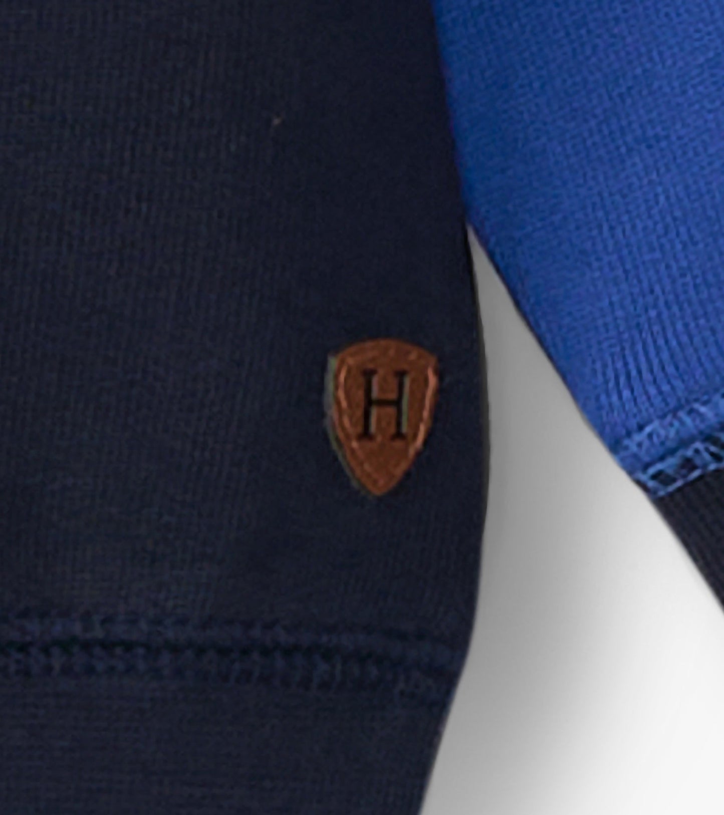 Navy and blue striped panel sweatshirt with a small logo patch on the sleeve, suitable for boys.