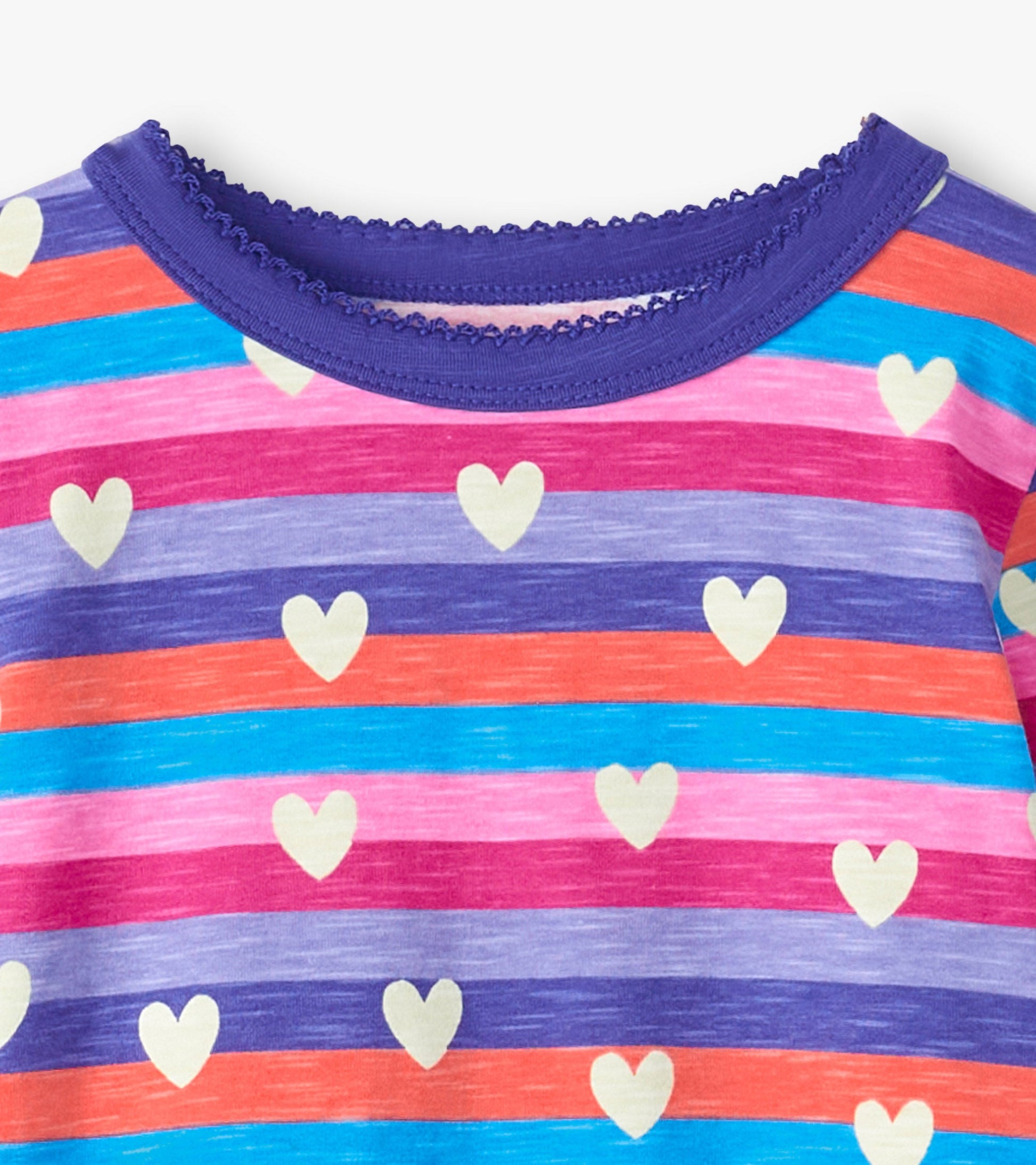 Colorful striped pajama top featuring hearts in shades of pink, purple, and blue with a scalloped neckline.