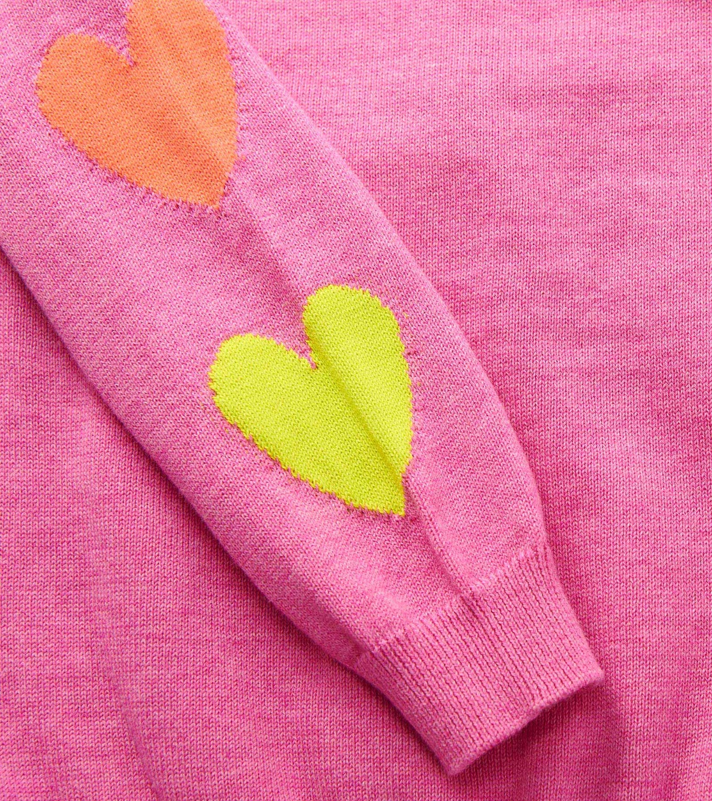 Pink sweater featuring colorful heart patches in orange and green on the sleeves, suitable for baby and toddler girls.