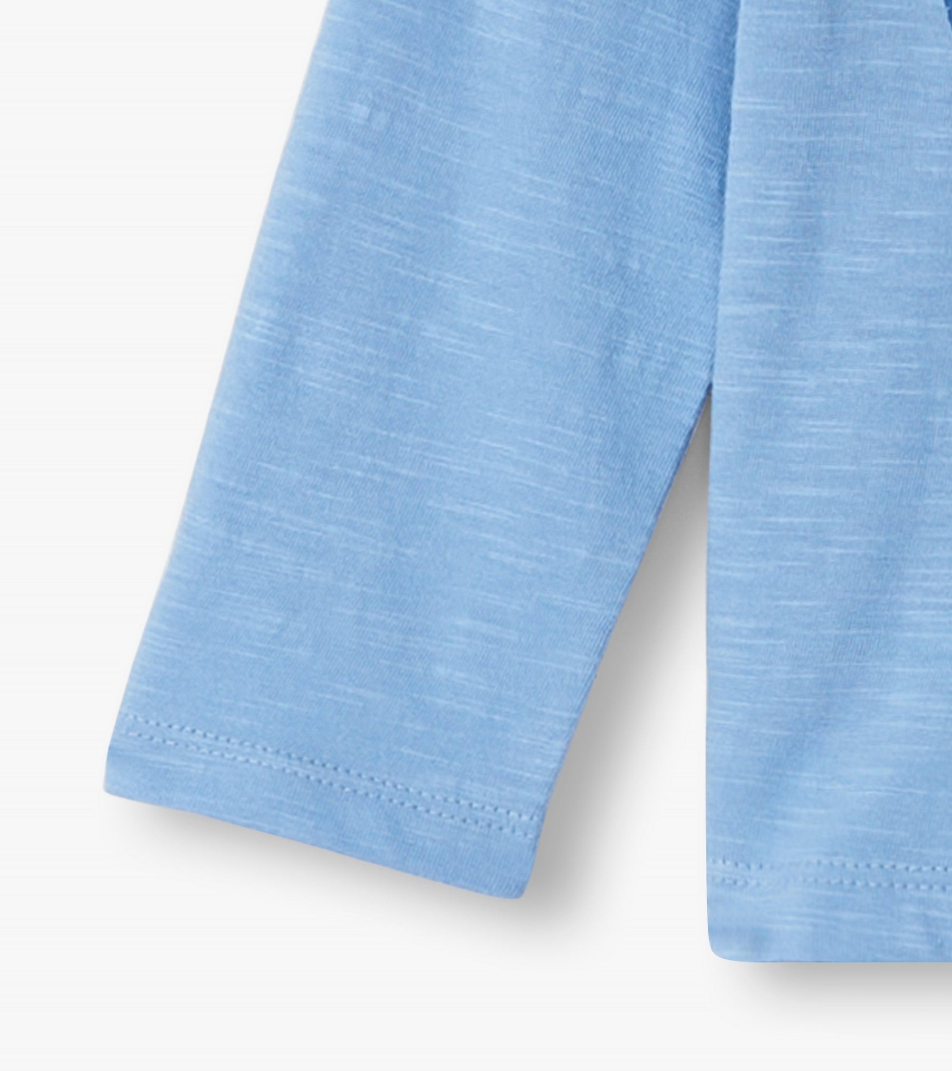 Light blue long sleeve t-shirt featuring a big groovy heart design, suitable for baby and toddler girls.