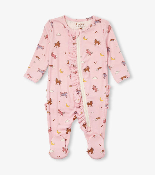 Pink bamboo sleeper with whimsical pony print, ruffle detailing, long sleeves, and footed design for baby girls.