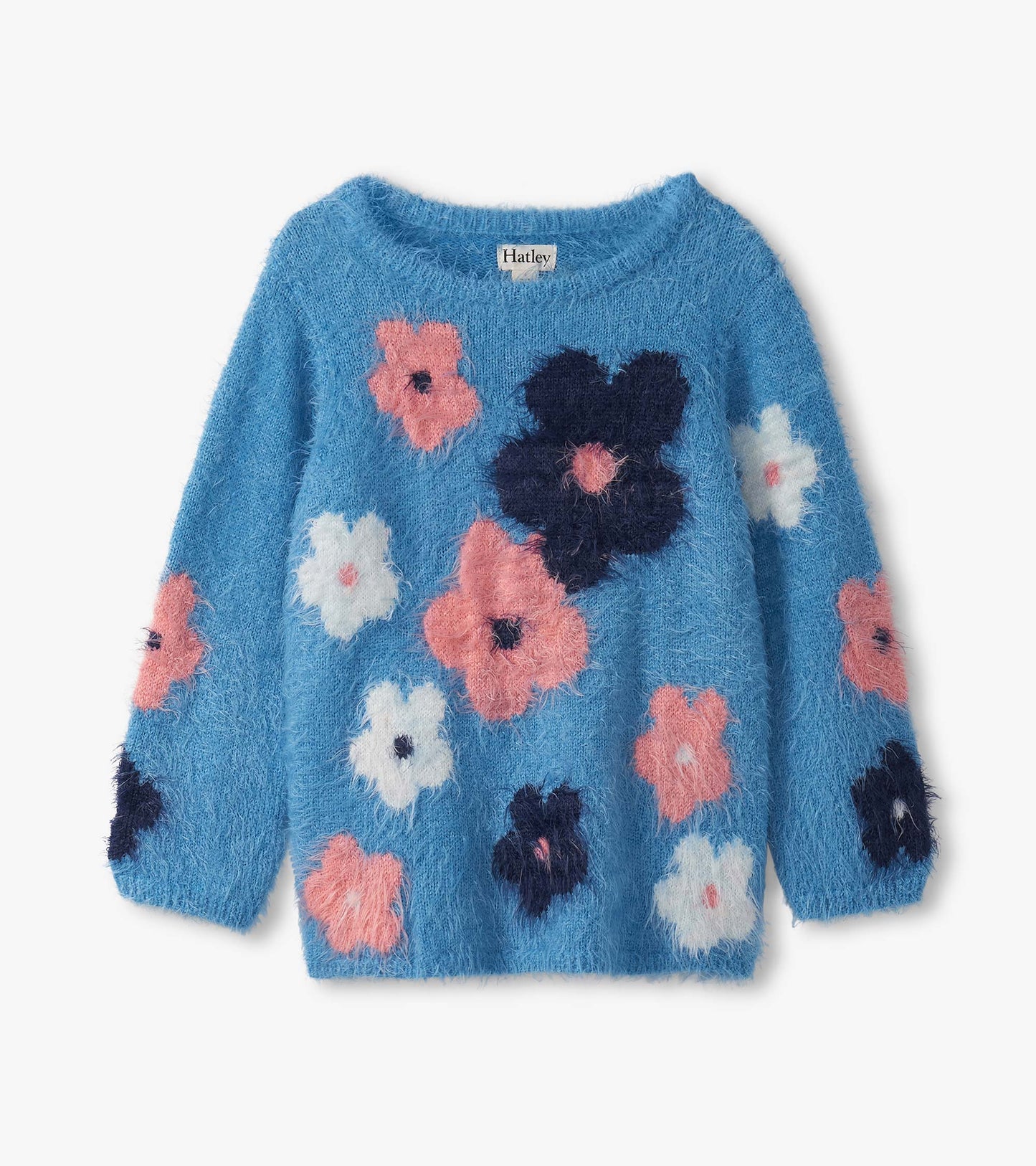 Blue furry sweater featuring colorful floral clusters in pink, white, and navy. Long sleeves and a round neckline.
