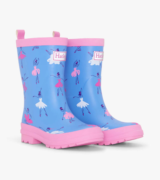 Matte blue rain boots featuring pink ballet dancer patterns and pink trim, designed for girls.