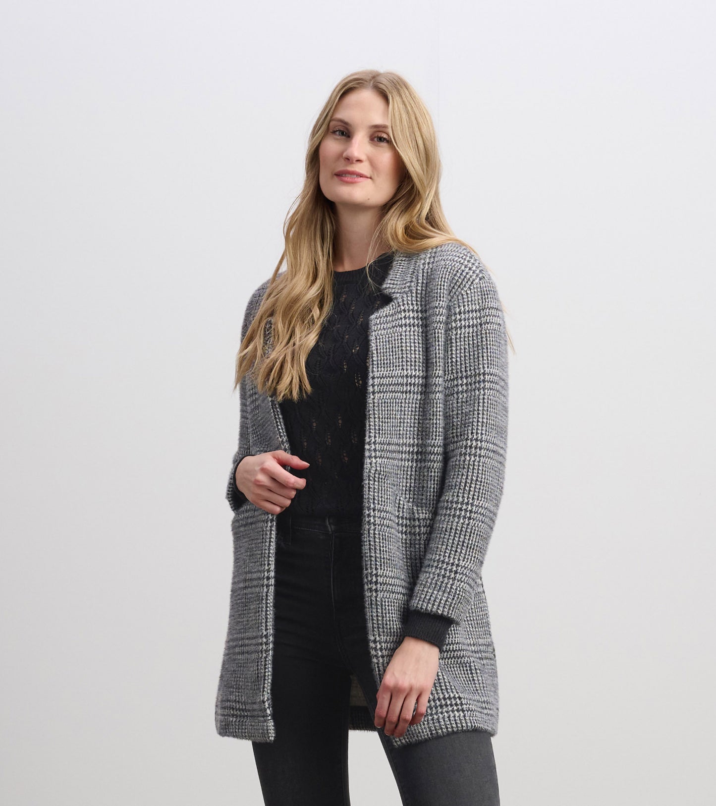 Cozy black check open blazer with long sleeves, featuring a relaxed fit and front pockets.