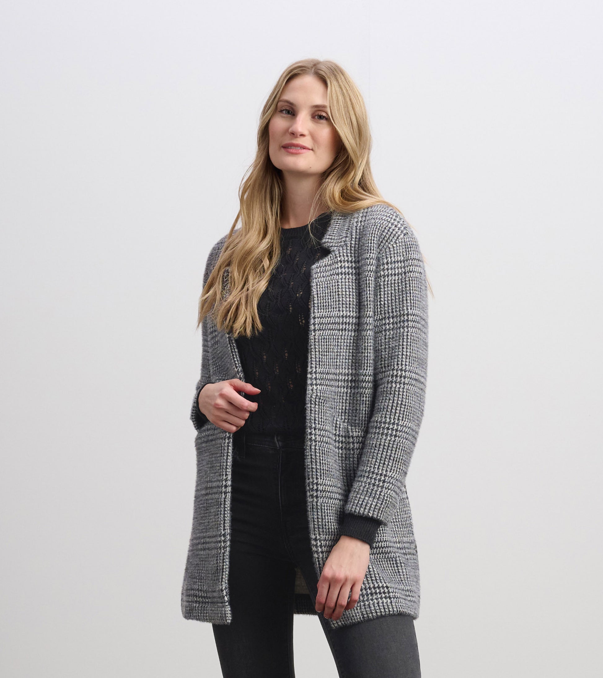 Cozy black check open blazer with long sleeves, featuring a relaxed fit and front pockets.