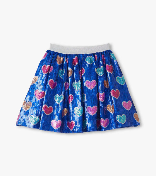 Blue sequin skirt featuring colorful heart patterns and an elastic waistband. Suitable for casual wear or special occasions.