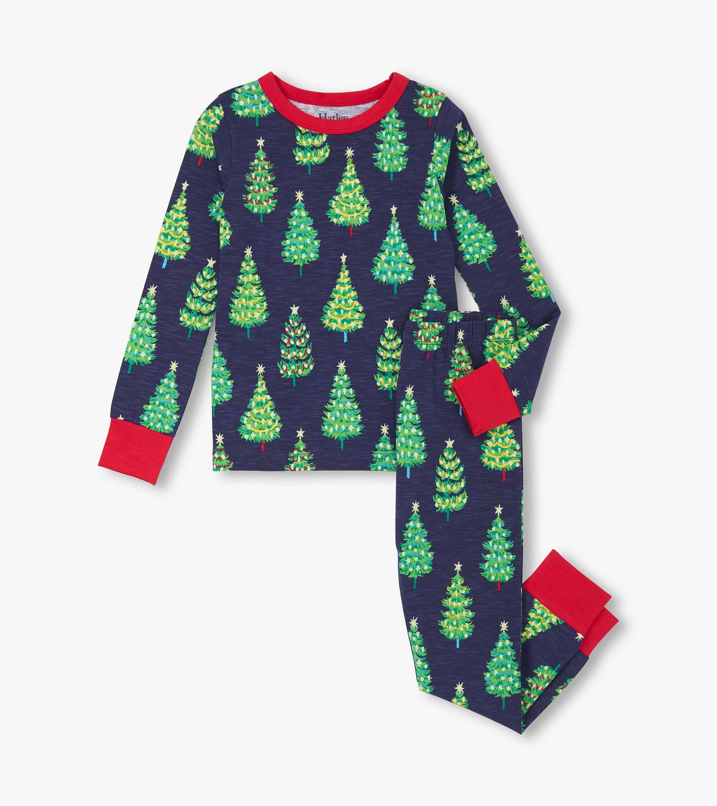 Navy cotton pajama set featuring colorful bottle brush trees, with red cuffs on the long-sleeve top and pants.