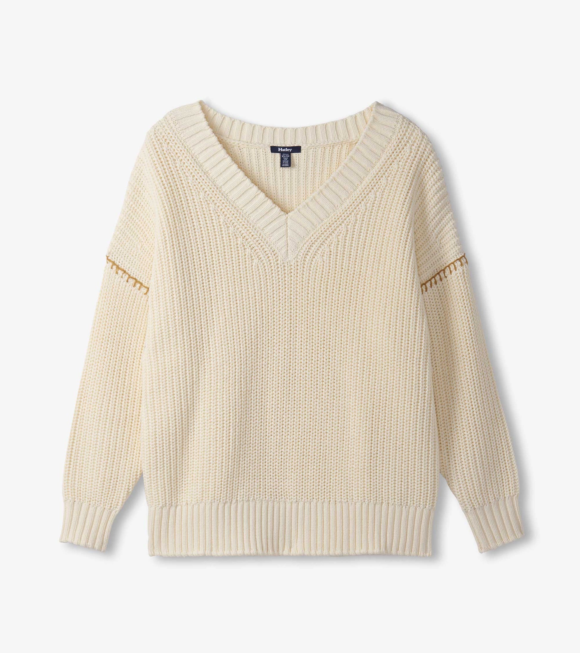 Cream V-neck slouchy sweater with textured knit and ribbed cuffs, featuring a relaxed fit and dropped shoulders.