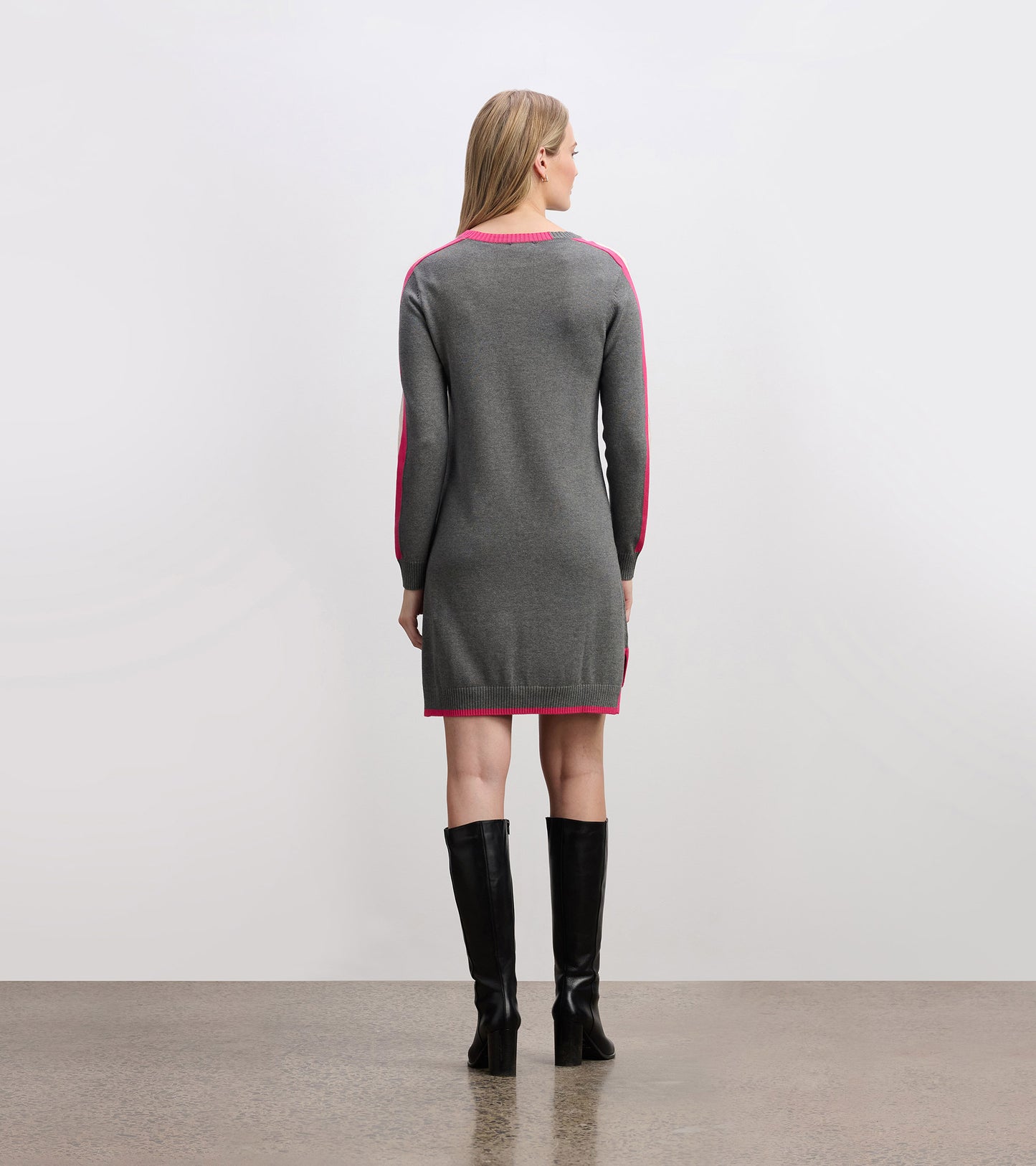 Charcoal sweater dress with contrast pink trim, long sleeves, and a fitted silhouette, viewed from the back.