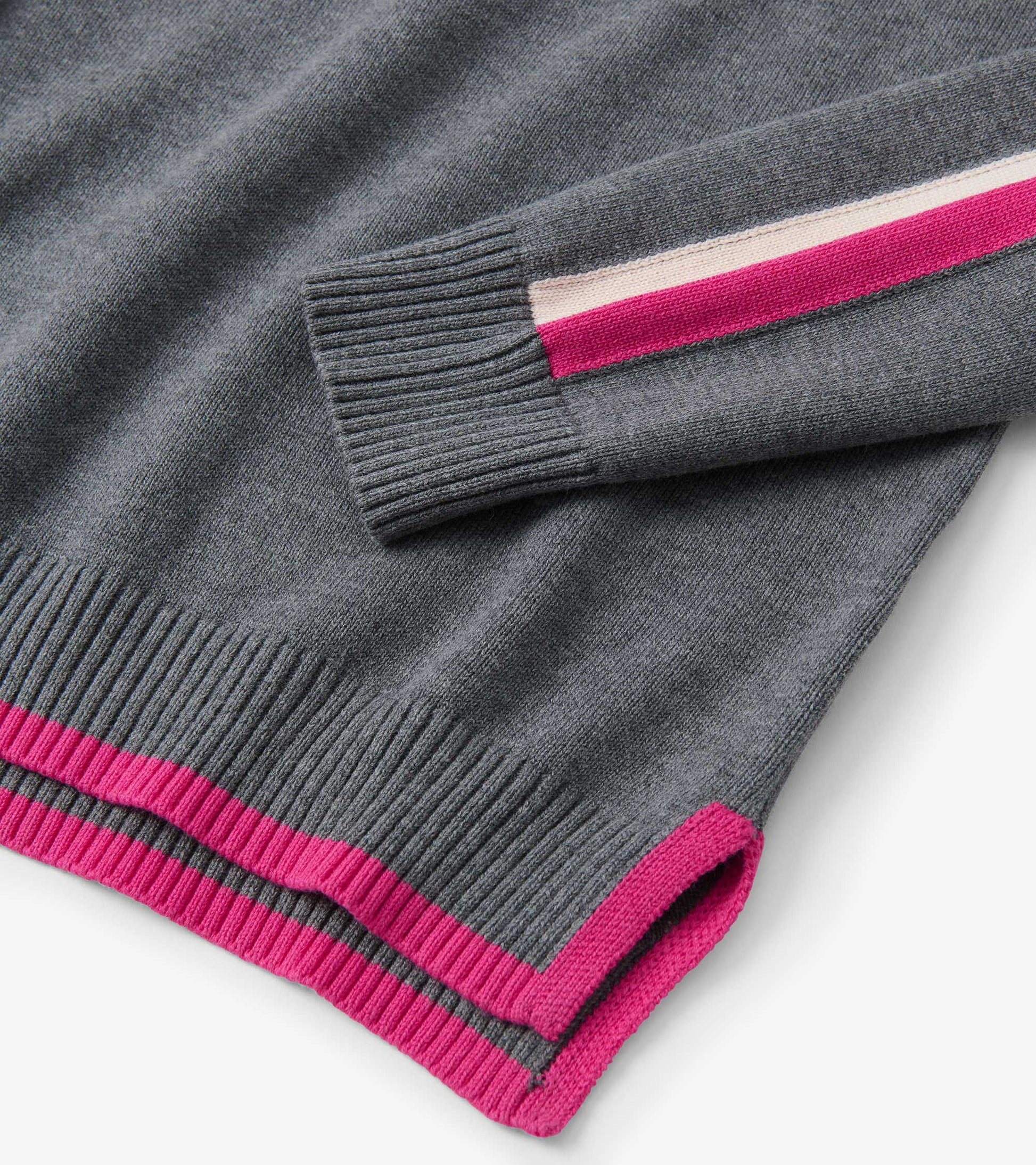 Charcoal sweater with ribbed cuffs and hem, featuring pink and cream contrast stripes on sleeves.