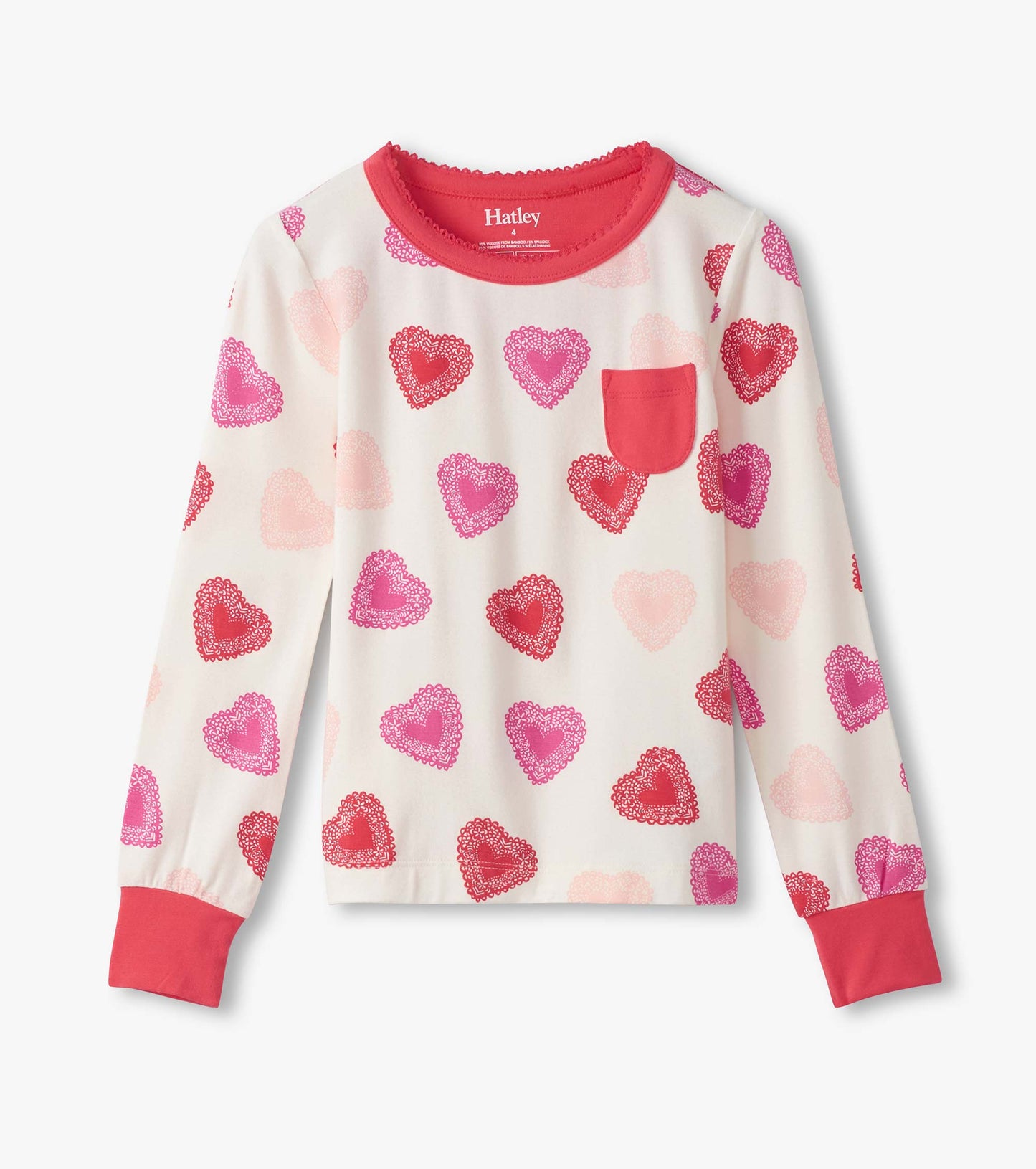 Long-sleeve pajama top featuring a cream background with colorful heart patterns and a red pocket.