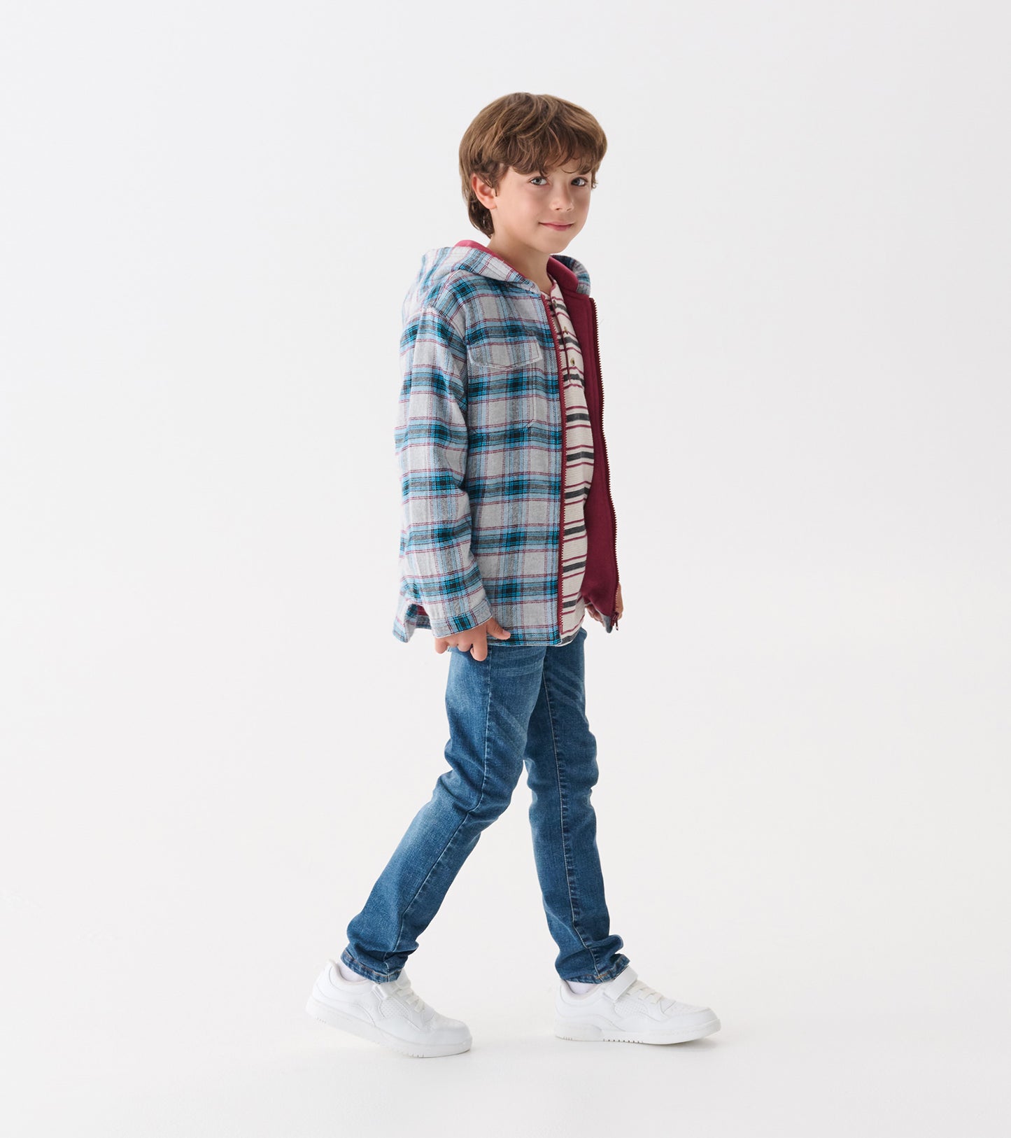 Boys' hooded jacket in charcoal and maroon plaid, featuring a lined interior, worn with jeans and sneakers.