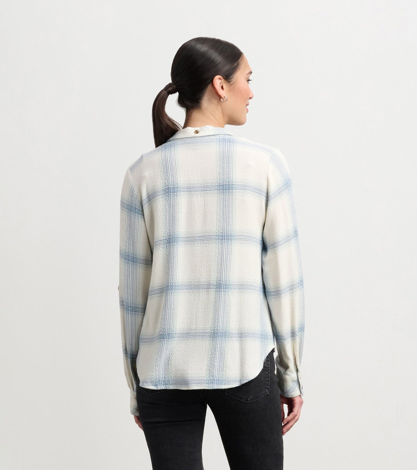 Turquoise plaid button-down shirt with long sleeves, featuring a relaxed fit and a rounded hem.