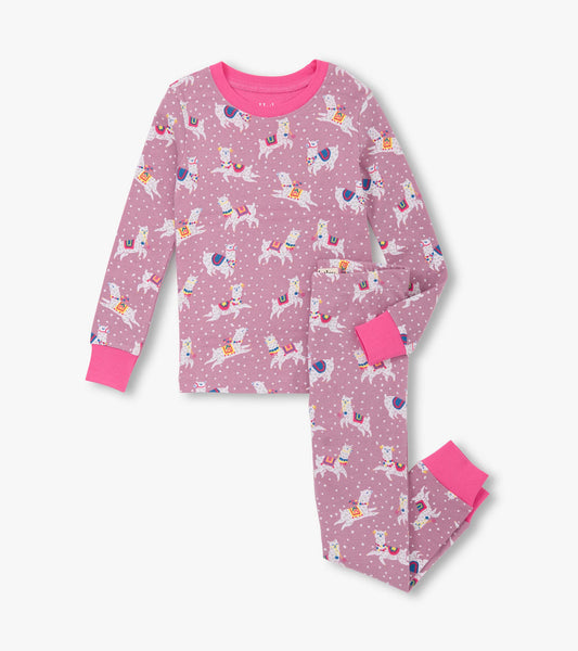 Pink cotton pajama set featuring dancing alpacas and colorful patterns, with long sleeves and matching pants.
