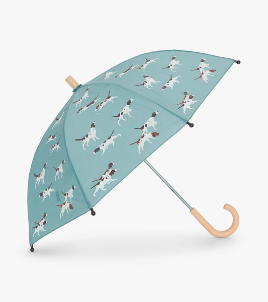 Teal umbrella featuring playful hunting dog patterns, with a curved wooden handle and metal frame.