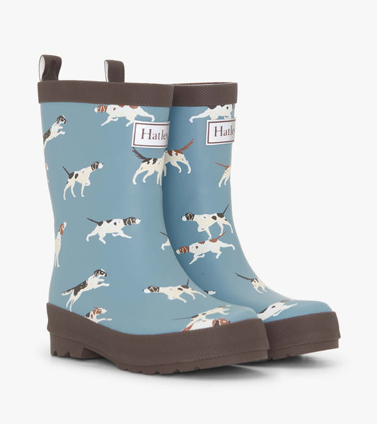 Matte blue rain boots featuring a playful dog pattern and brown soles, designed for boys.
