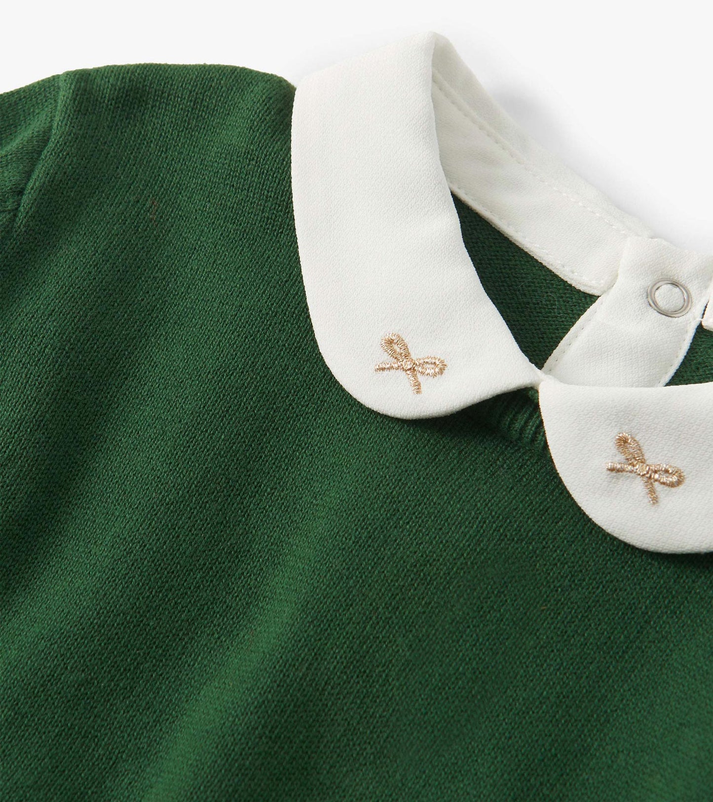 Green sweater featuring a white collar with gold bow embroidery. Suitable for girls, with a soft knit texture.
