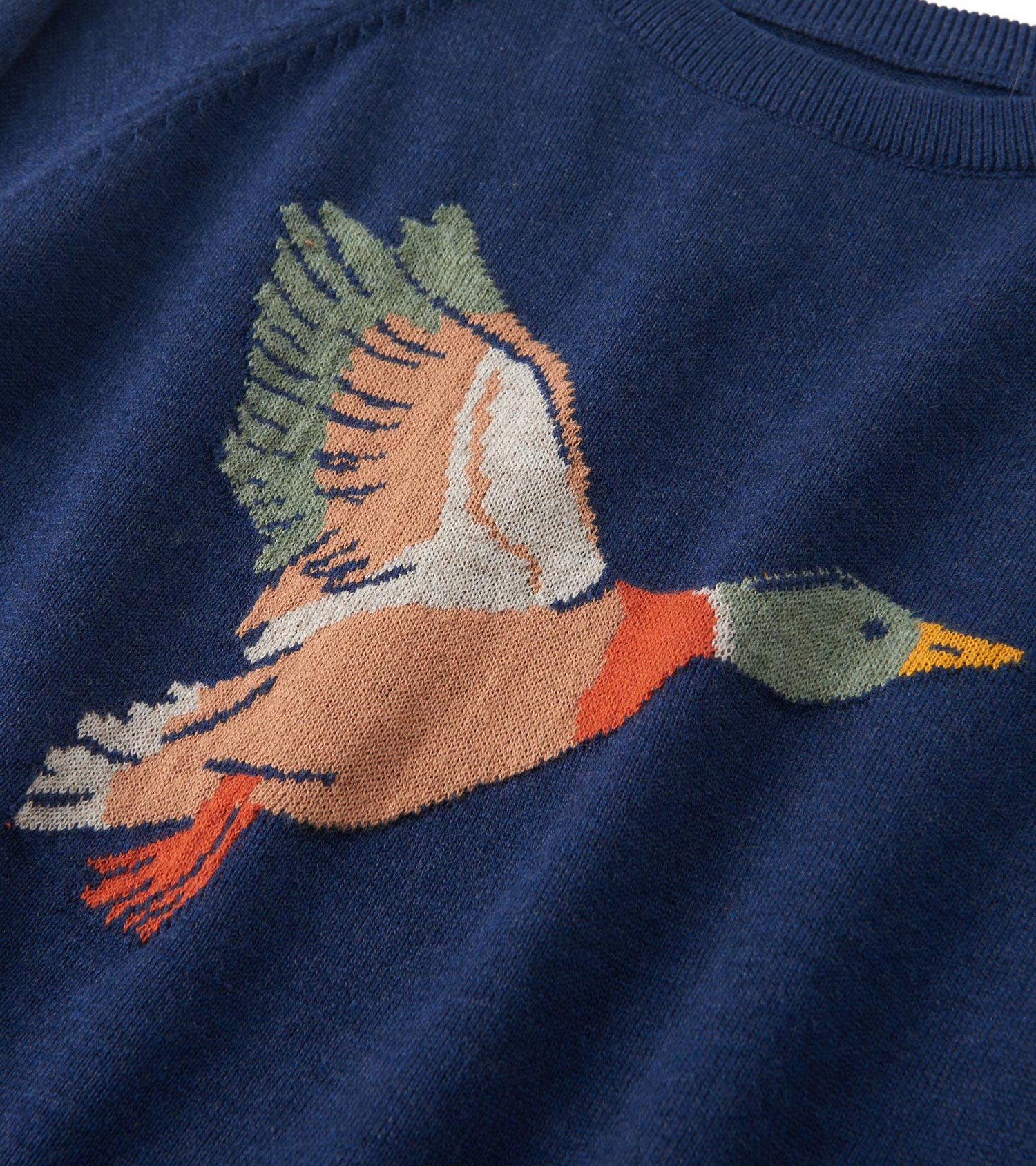 Navy crew neck sweater featuring a colorful duck graphic on the front, made from soft knit material.
