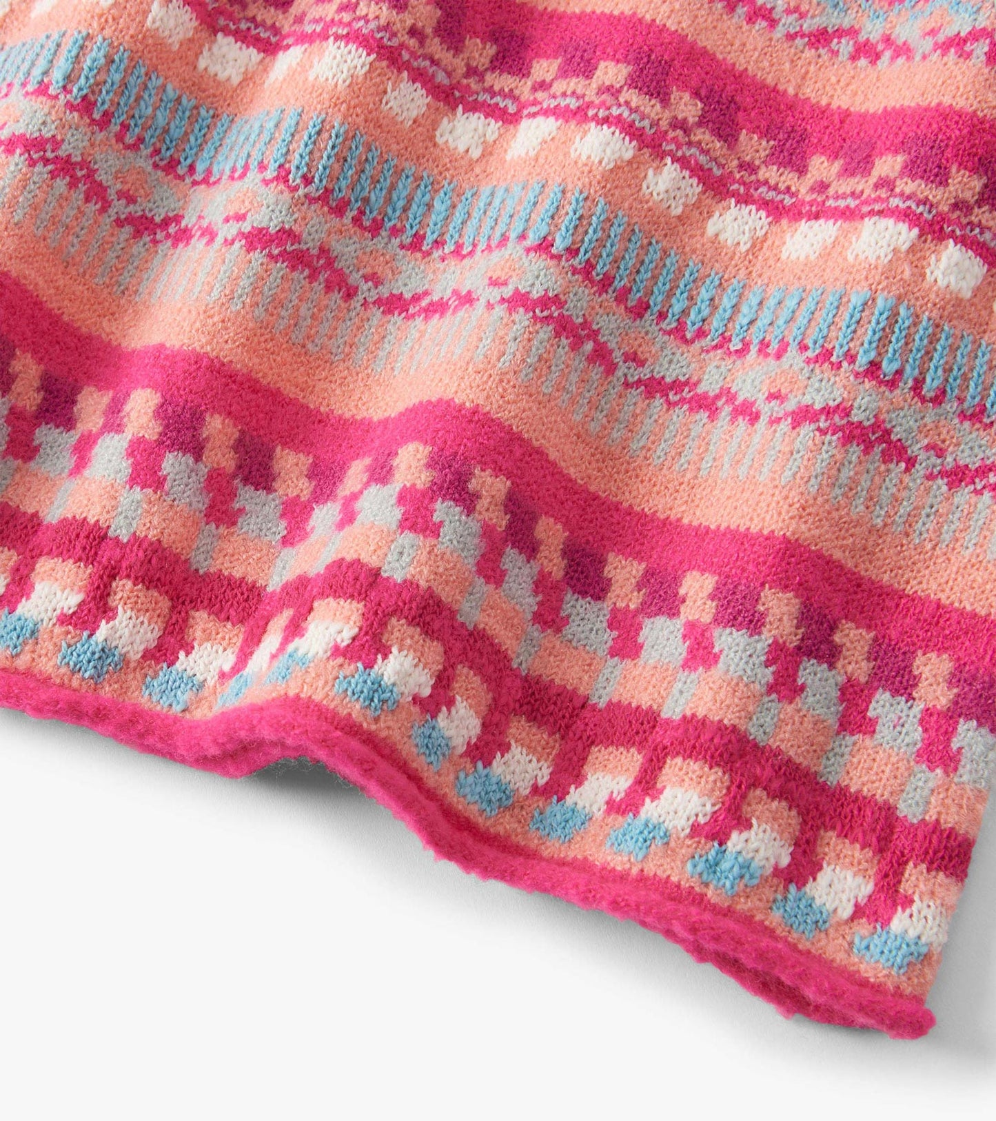 Knit sweater dress featuring vibrant pink, peach, and blue stripes with geometric patterns, ideal for casual wear.