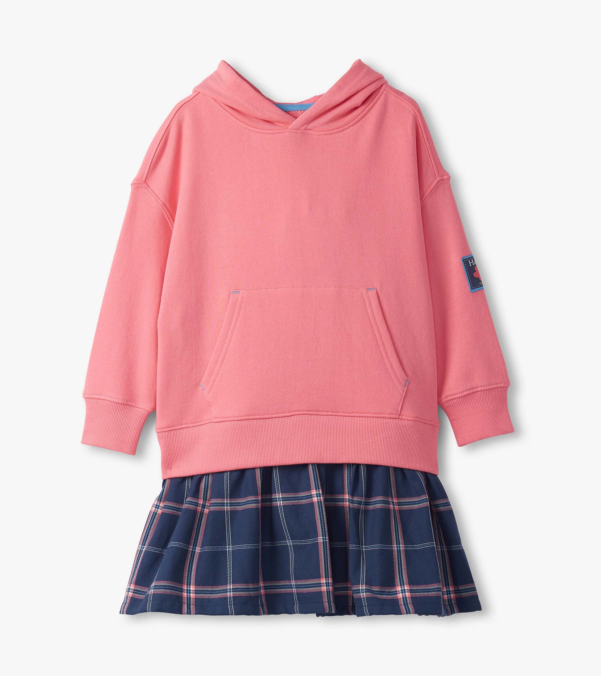 Pink hooded top with a front pocket paired with a navy plaid skirt featuring pleats.