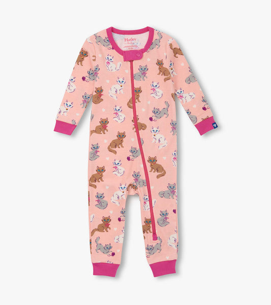 Pink cotton sleeper featuring a playful kitty print, long sleeves, and a front zipper closure.