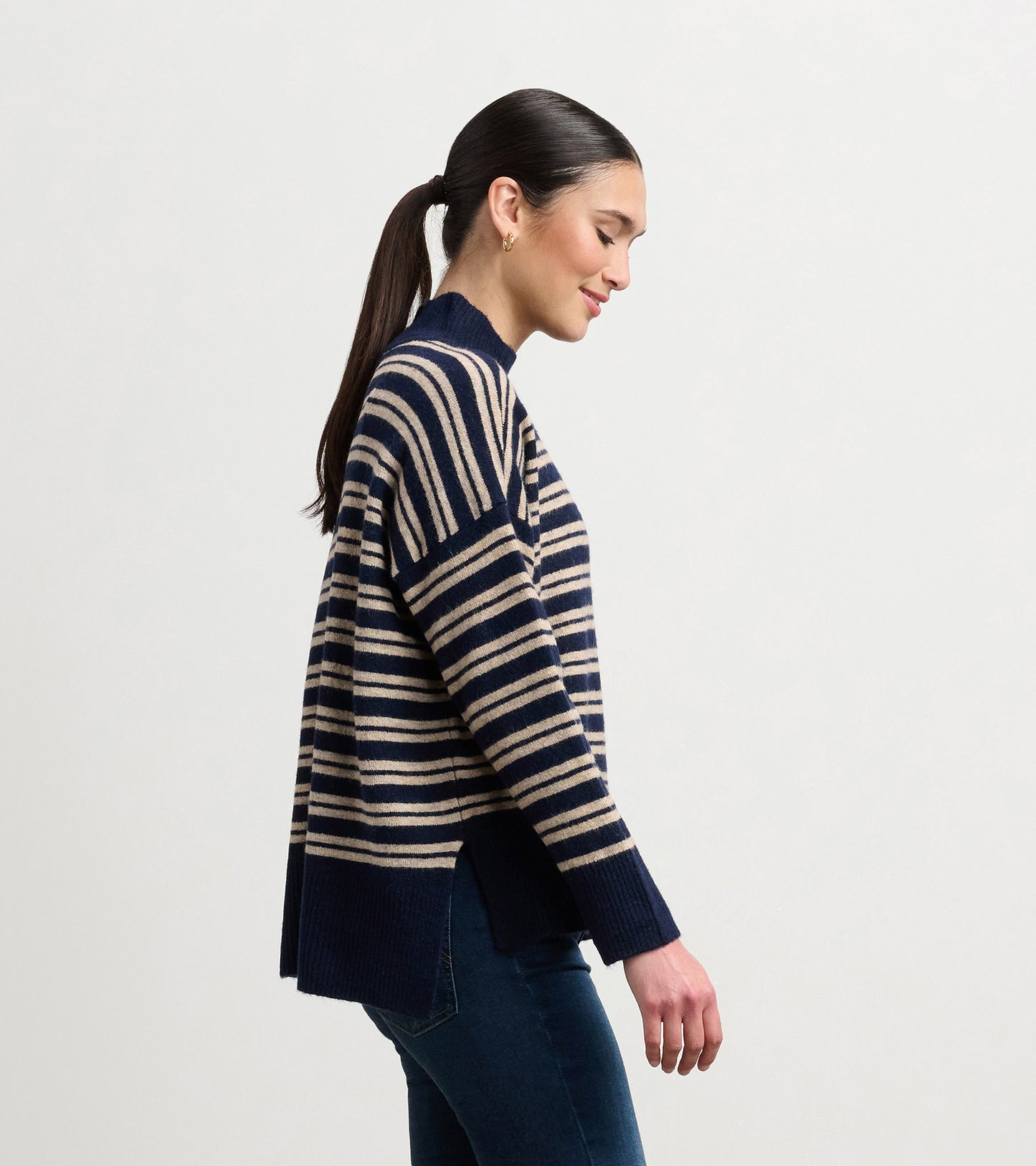 Navy and camel striped mock neck sweater with side slits, featuring a relaxed fit and long sleeves.
