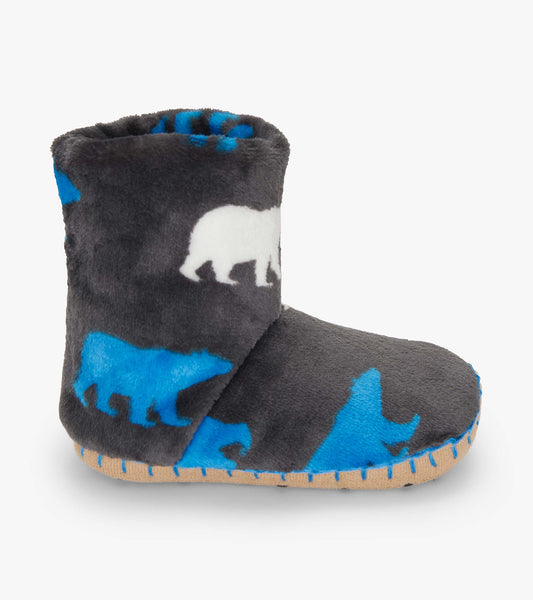 Gray fuzzy fleece slippers featuring polar bear silhouettes in white and blue, with a soft, cozy design.