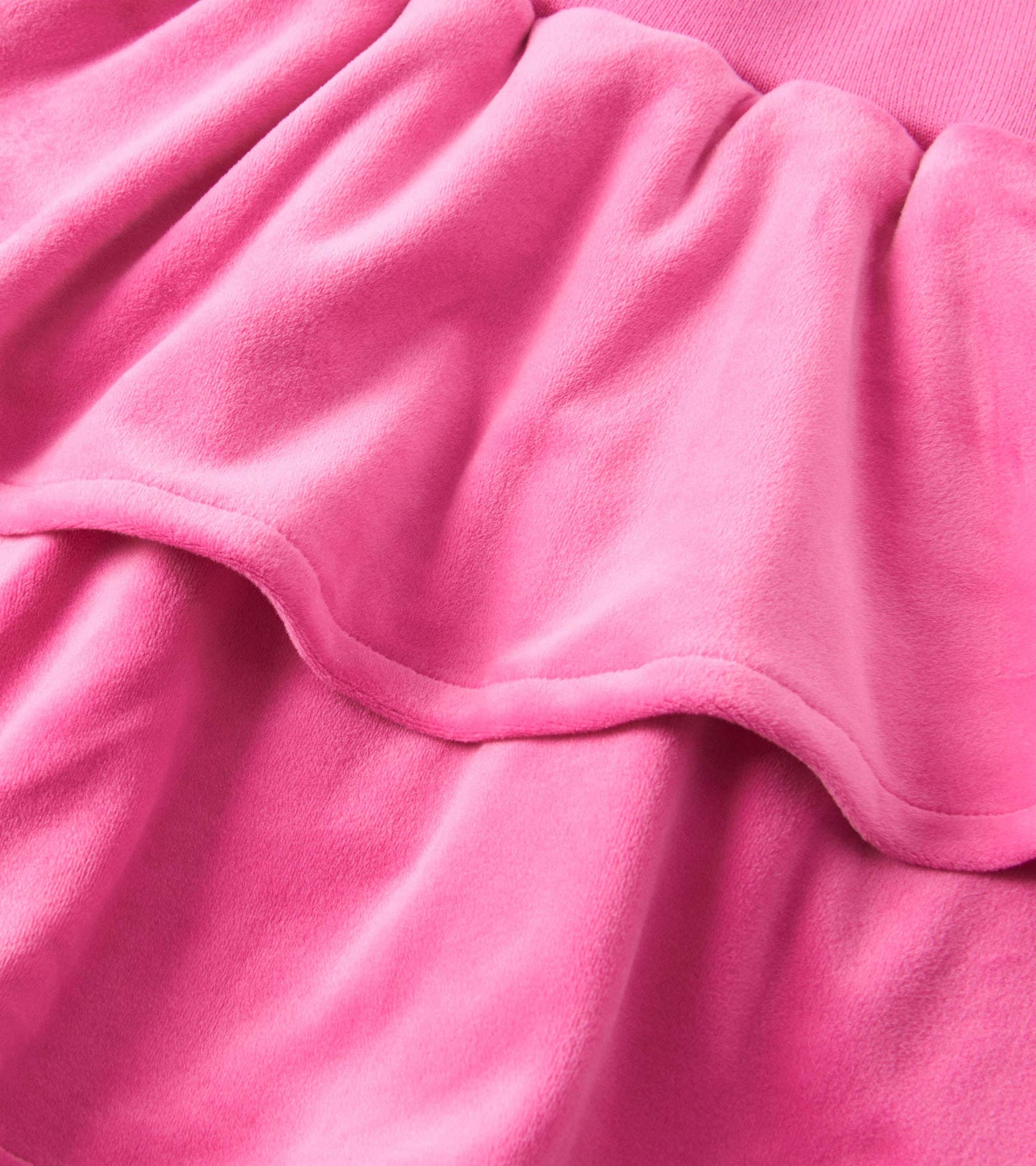 Raspberry pink velour skirt with layered ruffle design, soft texture, suitable for casual wear.