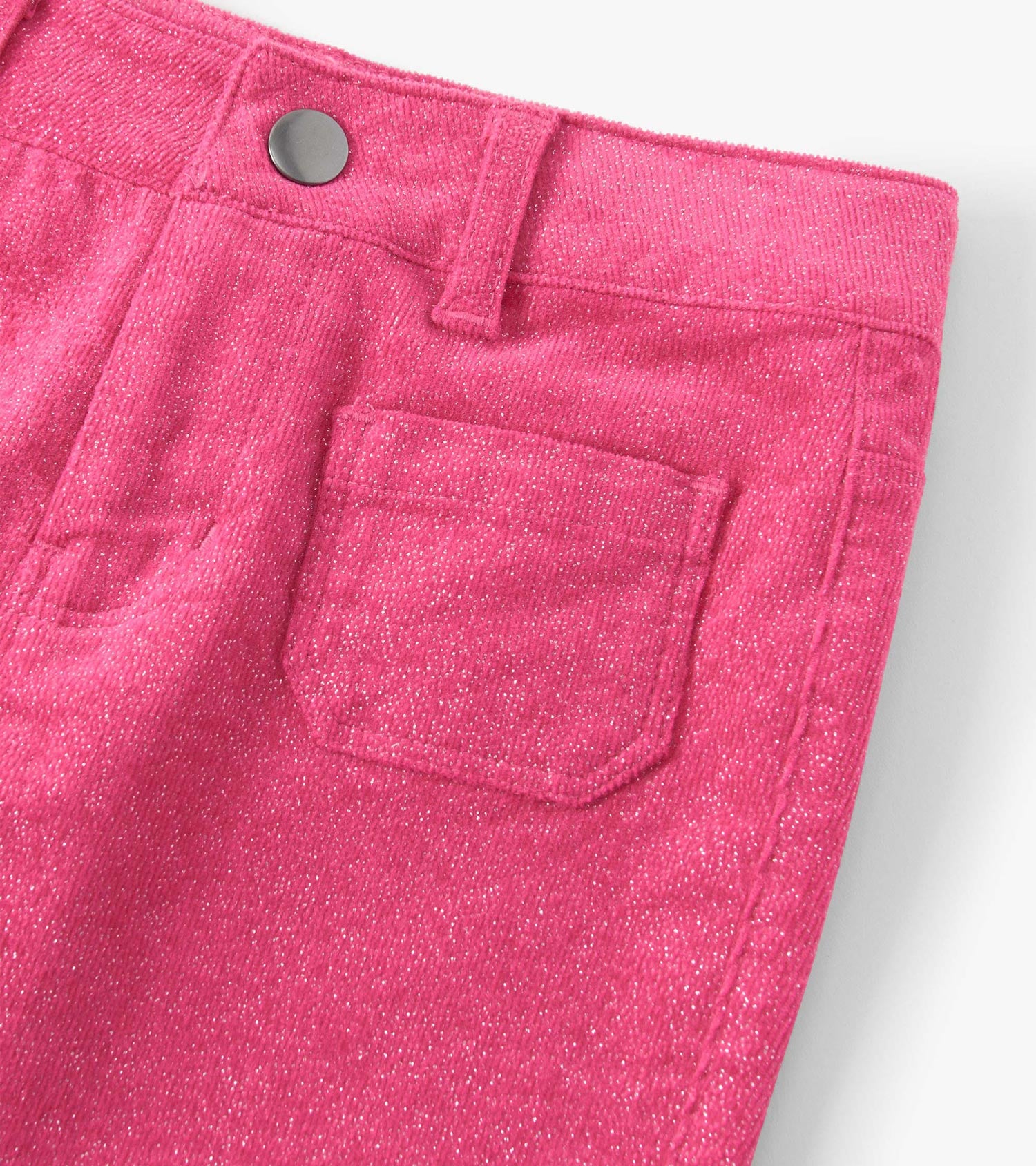 Flared pants in raspberry pink with a textured finish, featuring a patch pocket and a button closure at the waist.