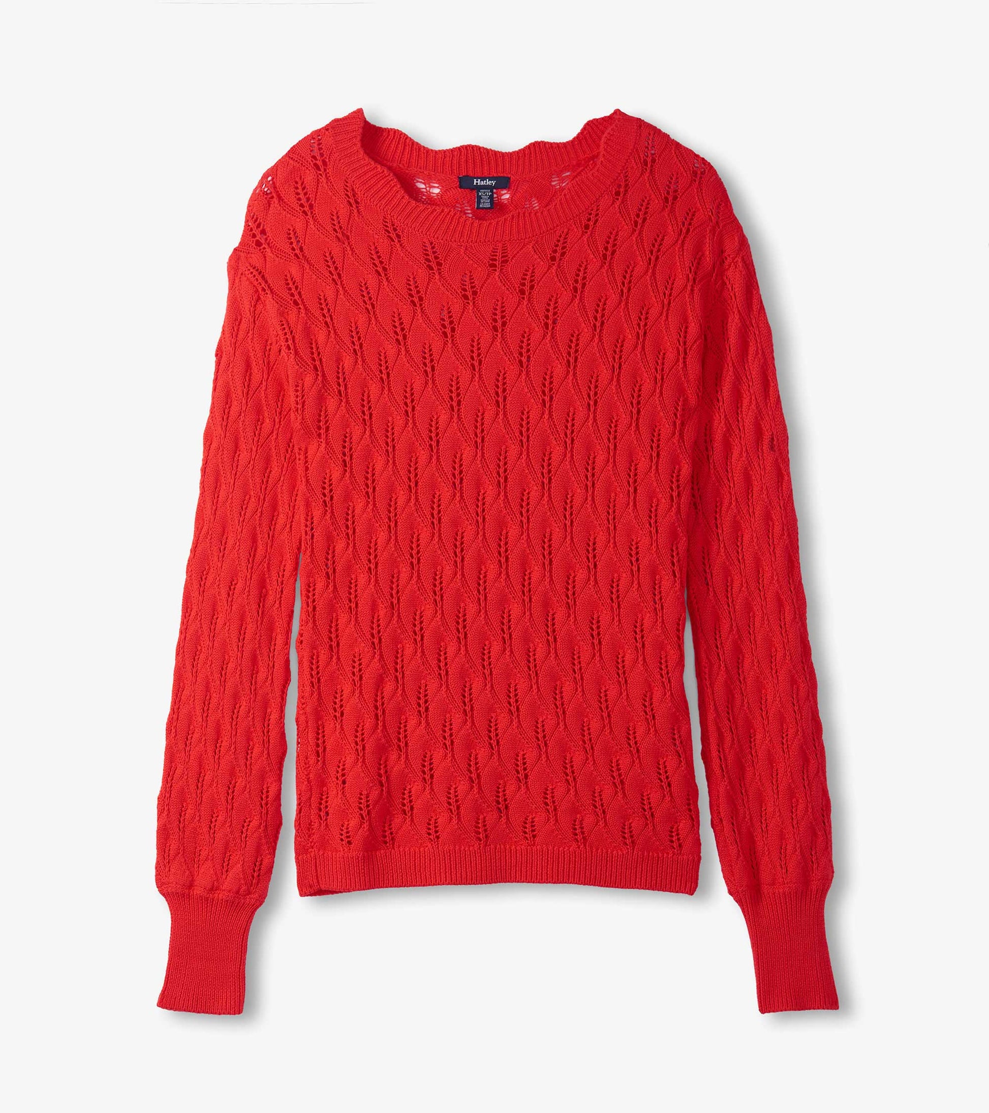 Ruby red sweater featuring a textured leaf pattern and ribbed cuffs, designed for a relaxed fit.