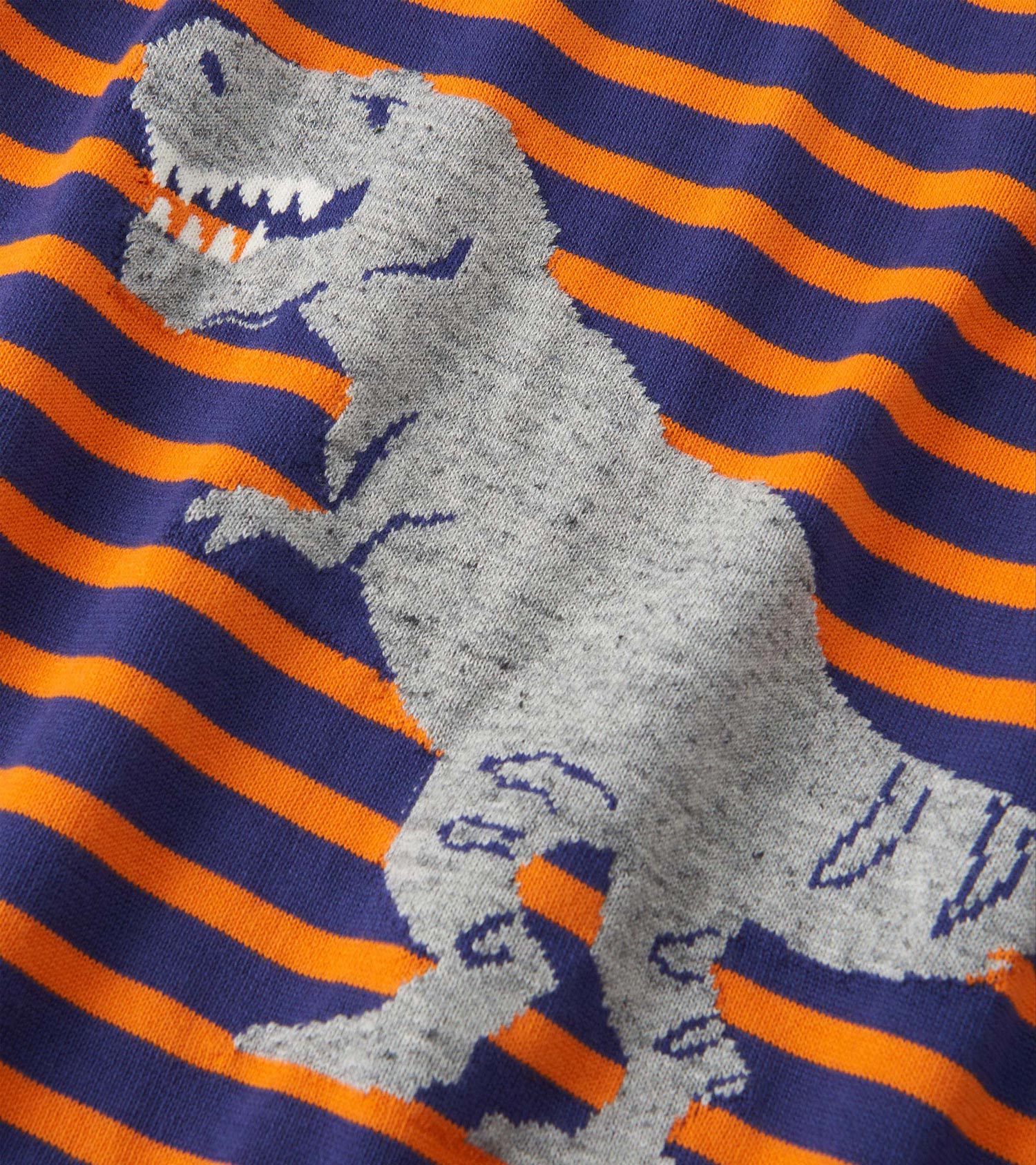 Gray sweater featuring a dinosaur graphic on navy and orange mixed stripes. Soft knit material suitable for casual wear.
