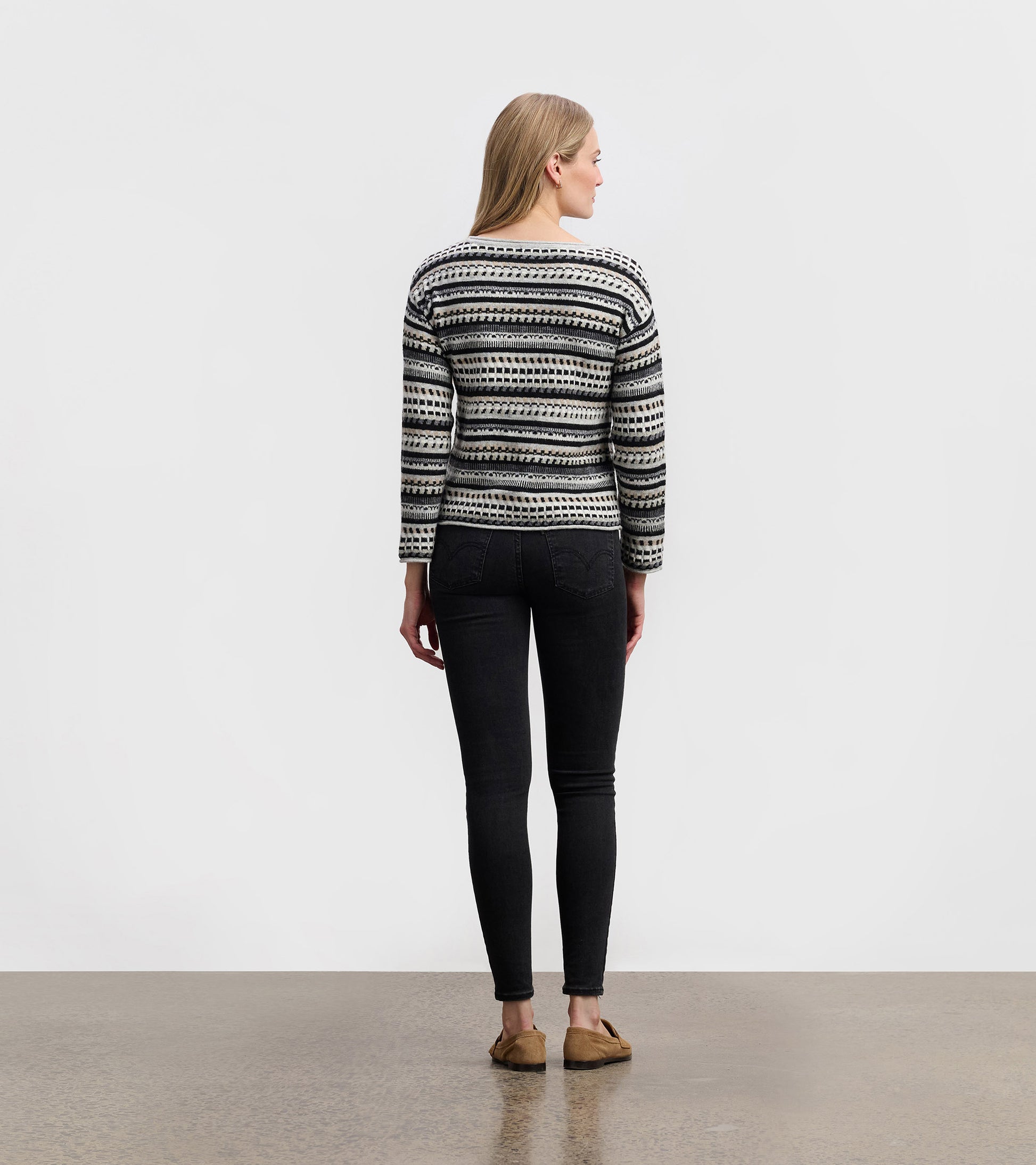 Stone grey sweater with a striped pattern, featuring long sleeves and a relaxed fit, viewed from the back.