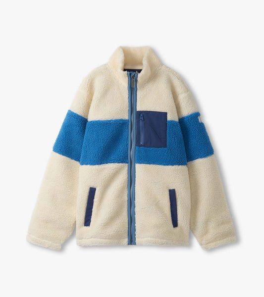White faux sherpa zip-up jacket with blue and navy color blocks and a chest pocket.