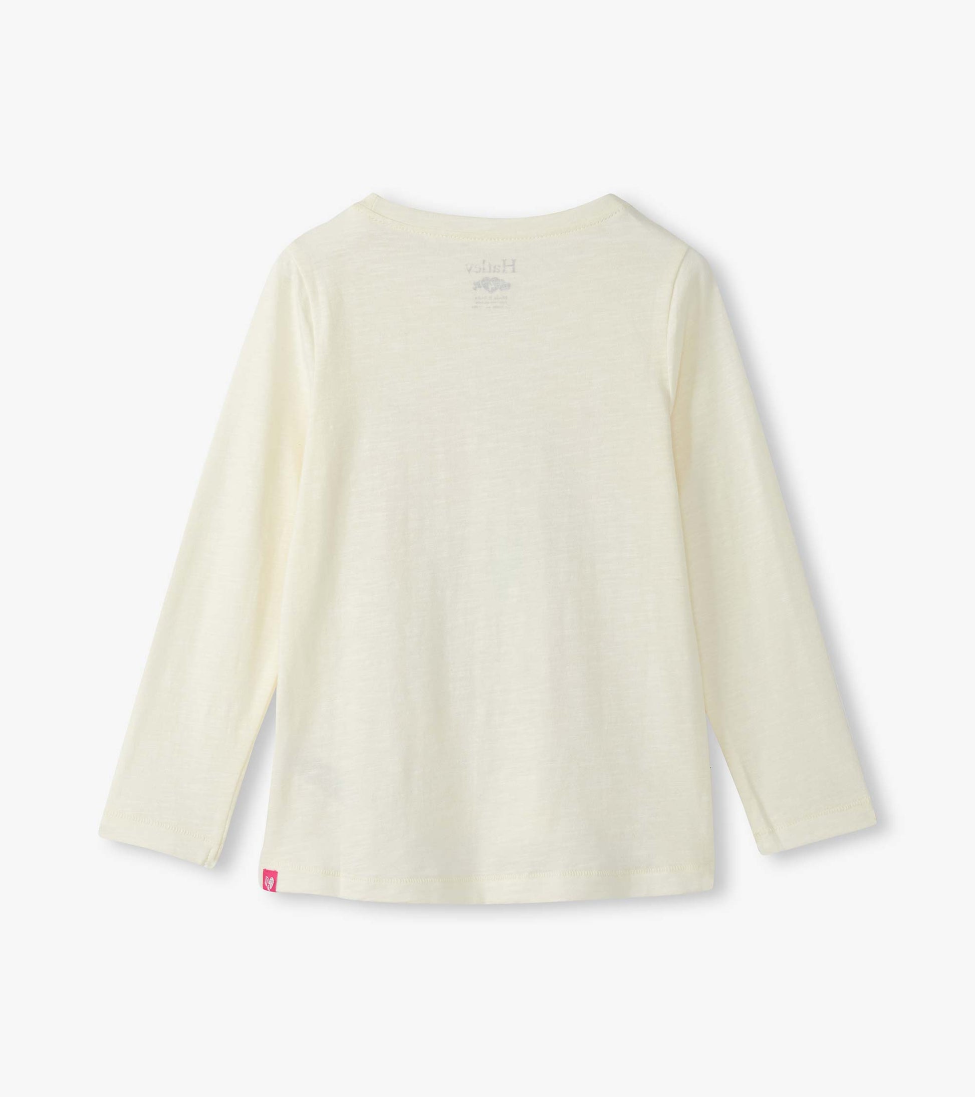 Light yellow long sleeve graphic tee with a soft texture and a simple design, featuring a tag at the hem.