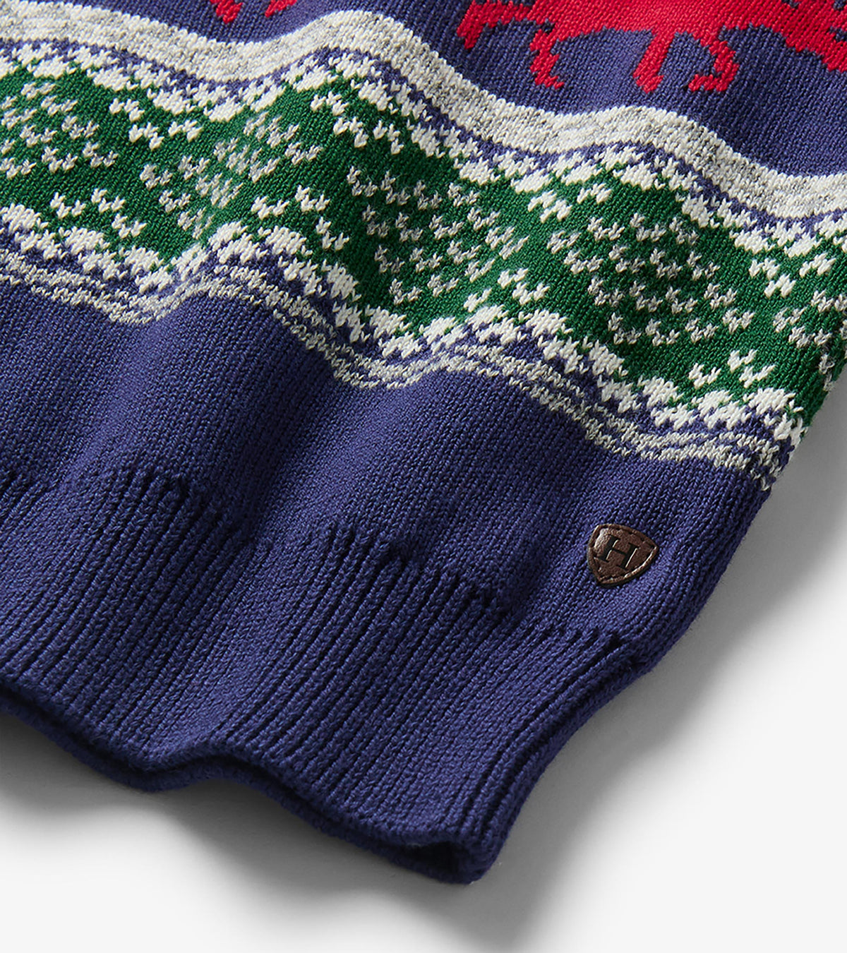 Close-up of blue ribbed hem and green Fair Isle knit pattern on boys holiday sweater