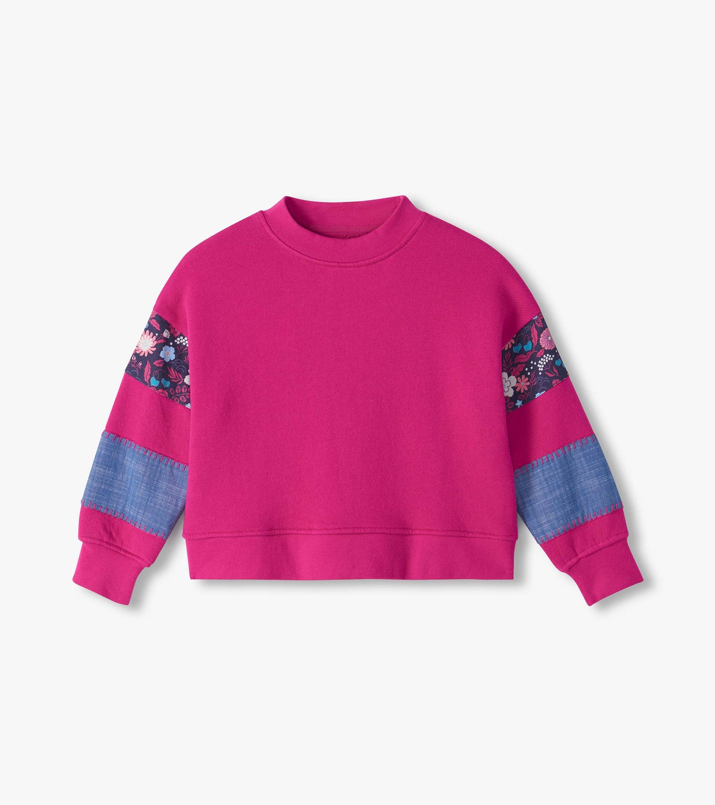 Girls bright pink pullover with floral shoulder panels and blue contrast sleeve patches