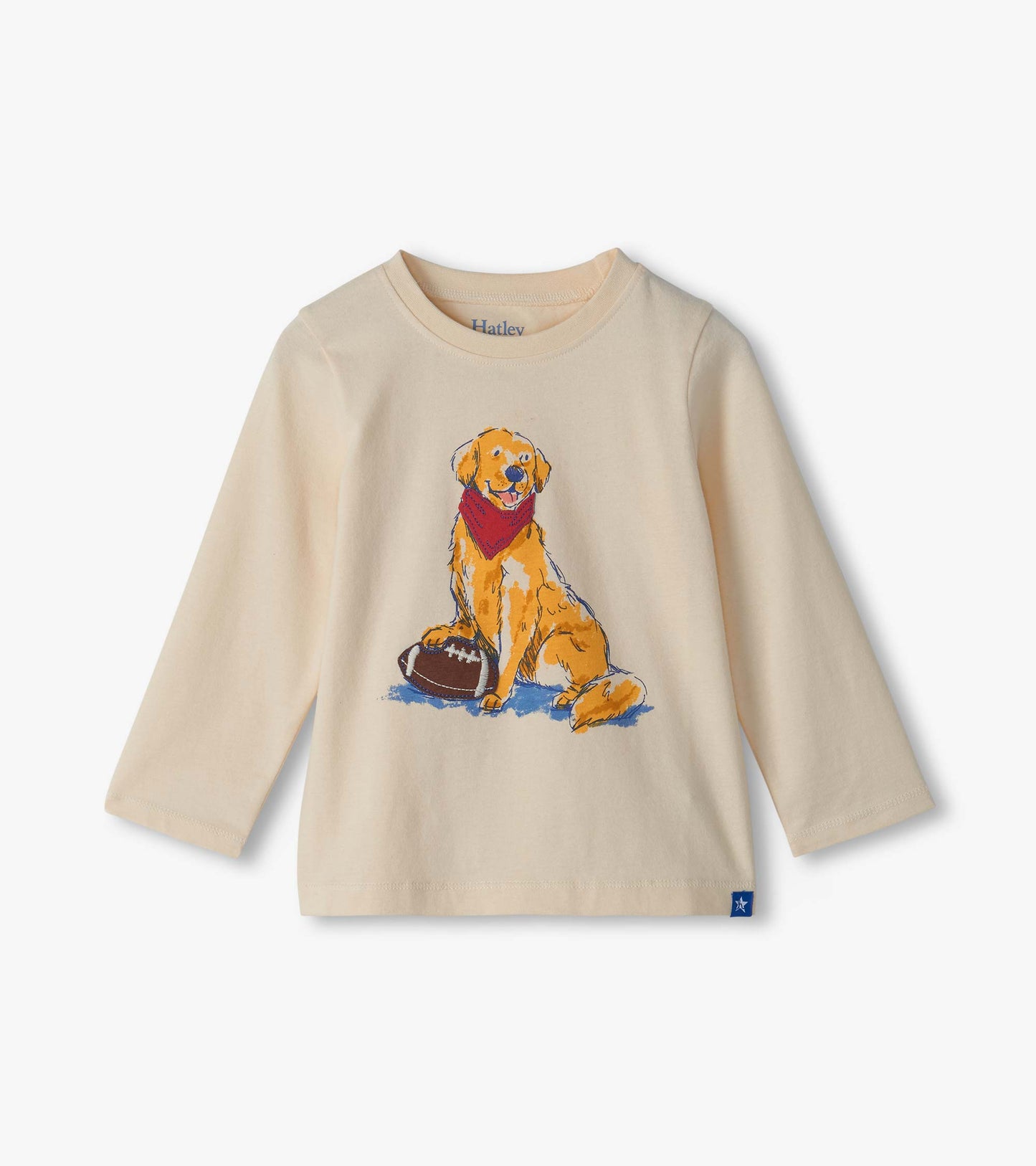 Cream long-sleeve crew neck tee with a golden lab graphic wearing a red bandana beside a football