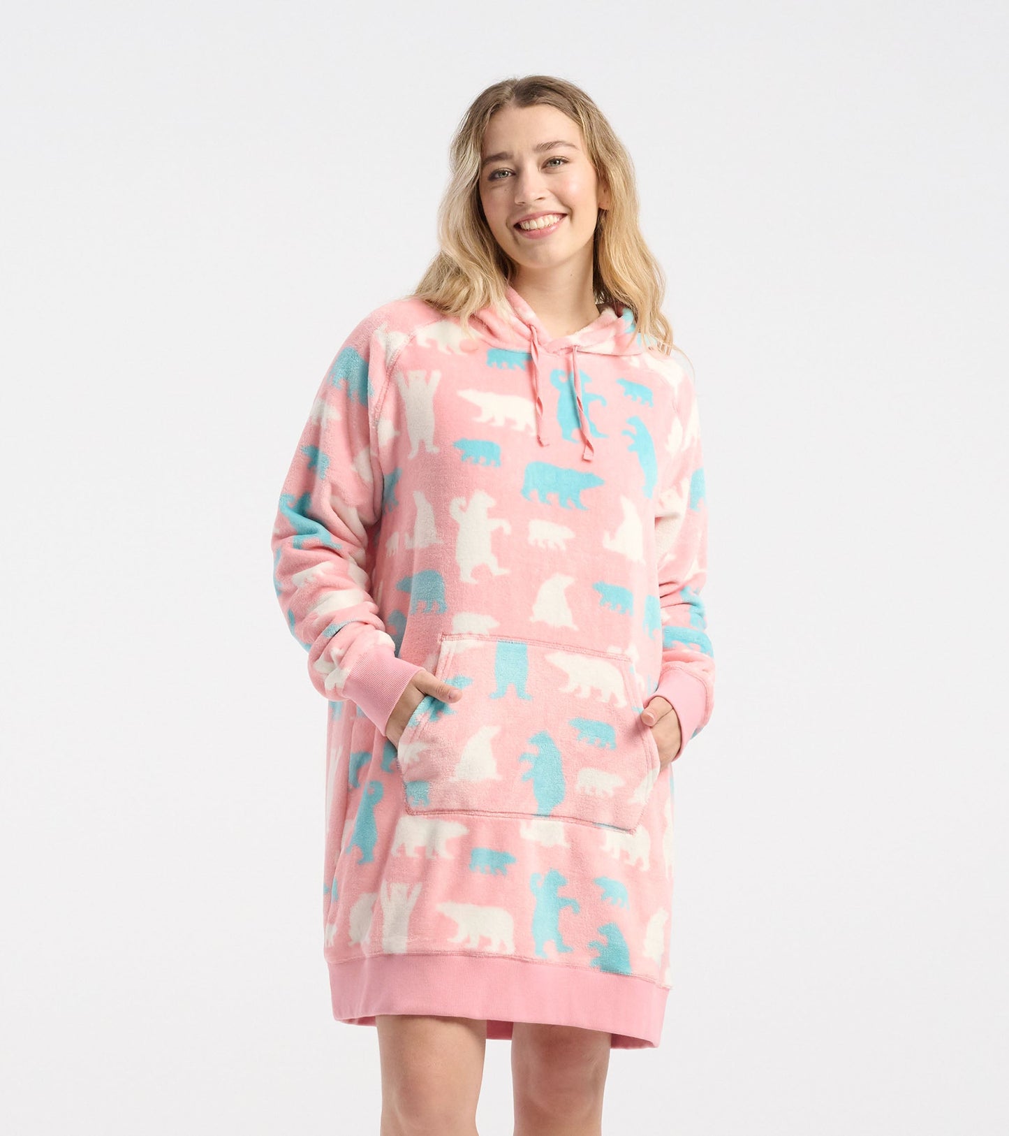 Pink oversized fleece hoodie featuring polar bear patterns in white and blue, with a front pocket and drawstring hood.
