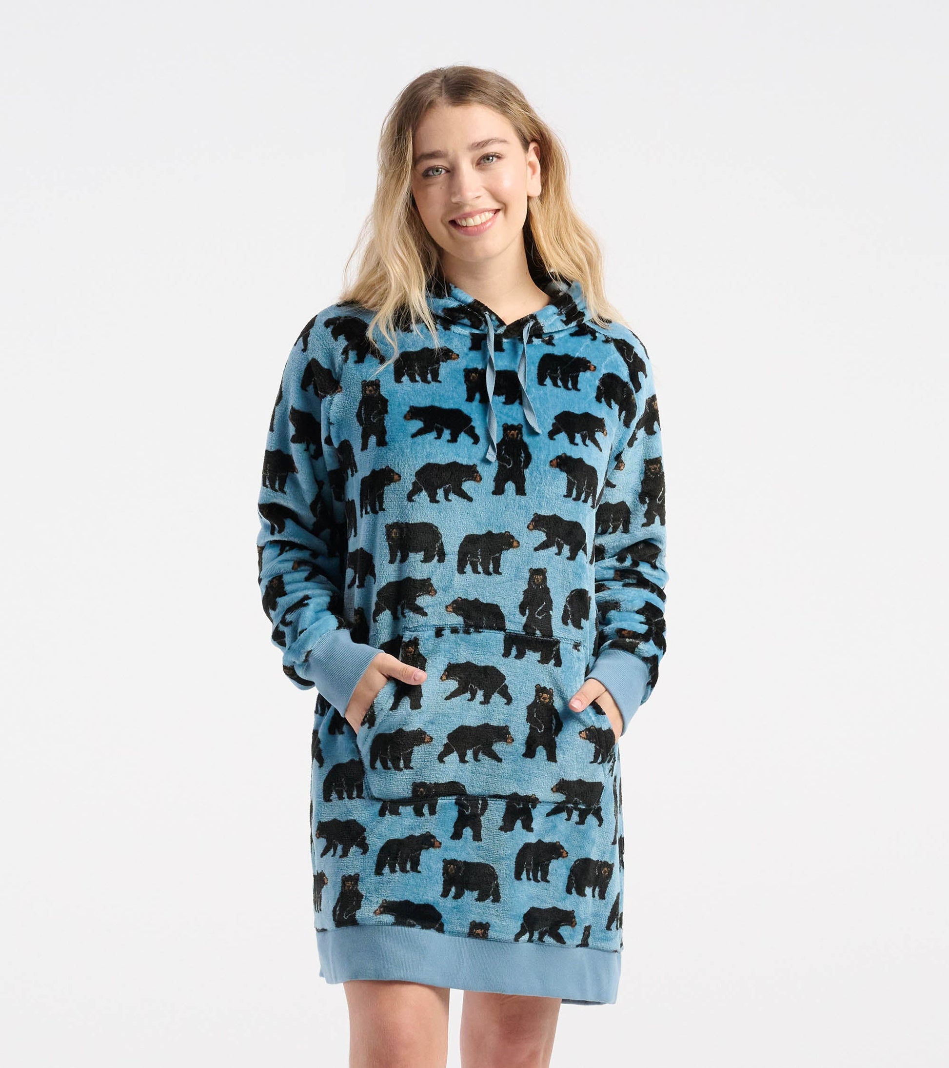 Oversized fleece hoodie in blue with black bear pattern, featuring a front pocket and drawstring hood.