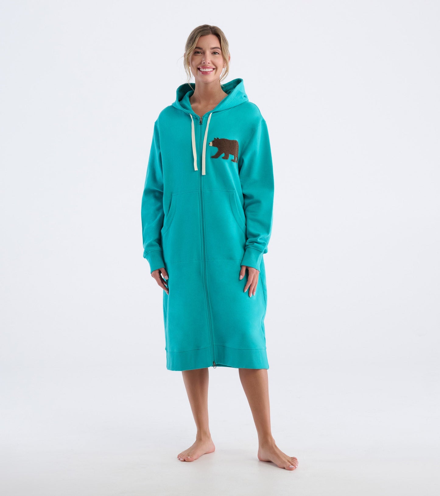 Turquoise oversized zip-up hoodie with a bear design, featuring a hood and front pockets.