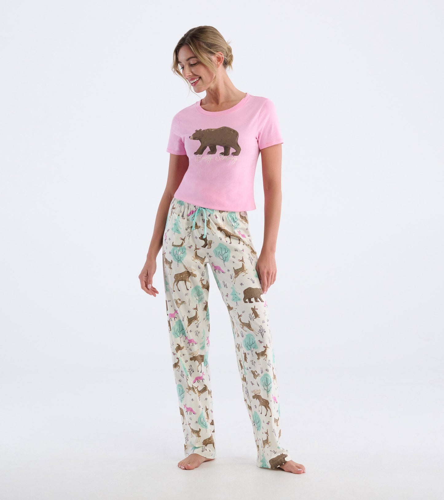 Lightweight cotton pajama pants featuring a playful forest animal print in soft colors, ideal for lounging or sleeping.